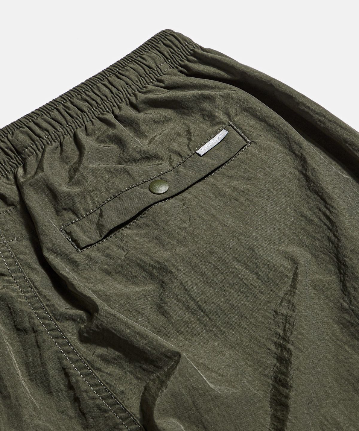 에스피오나지(ESPIONAGE) Nylon Warm Up Pants Dark Olive