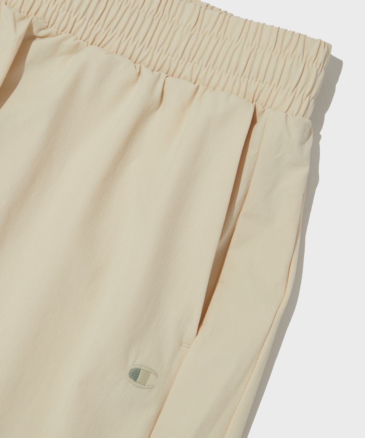챔피온(CHAMPION) 여성 오가닉 풀 스트레치 우븐 팬츠 Light Beige