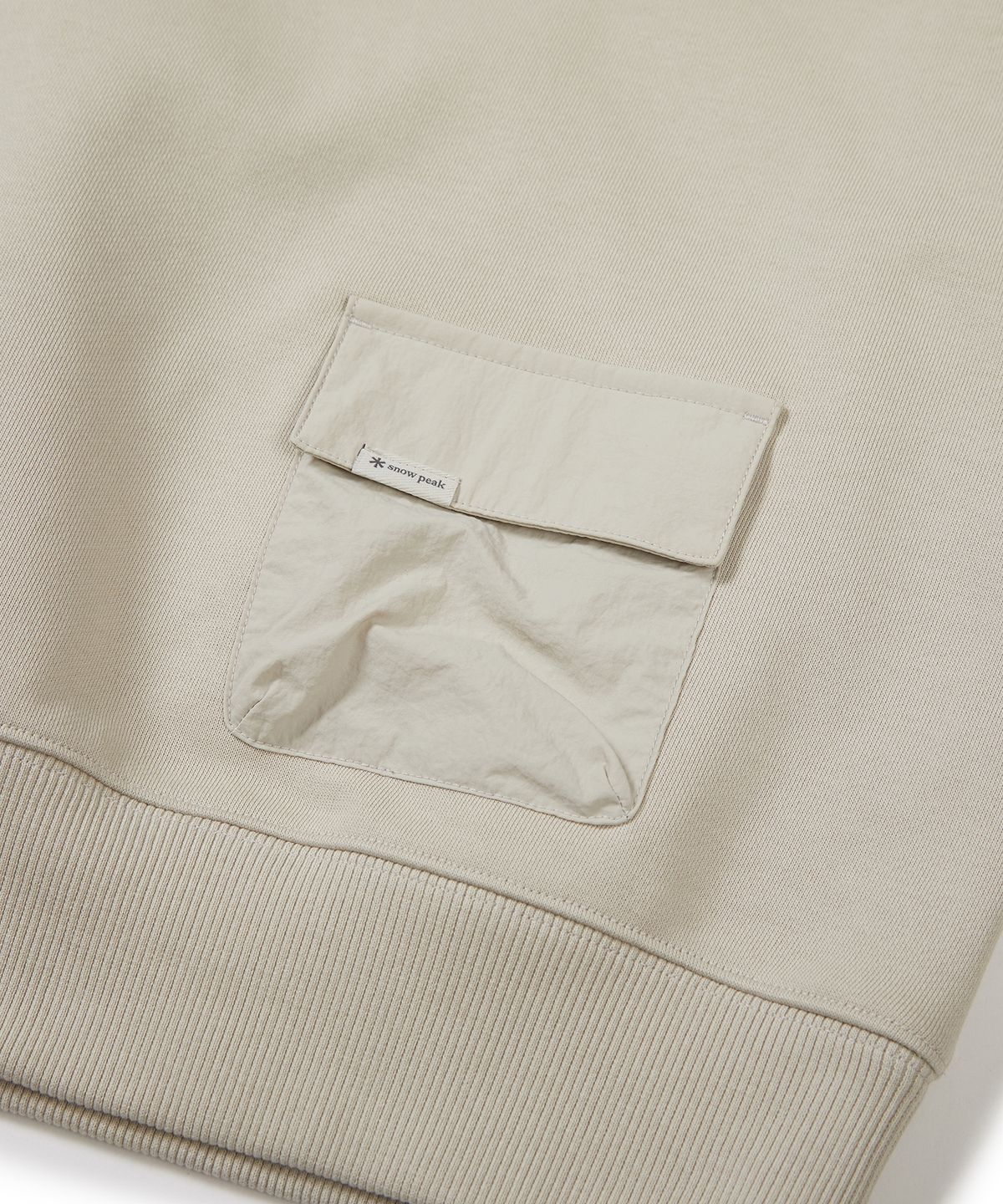 스노우피크 어패럴(SNOWPEAK APPAREL) 랜드 우먼스 우븐 포켓 기모 맨투맨 Light Beige (S23FWFHT62)