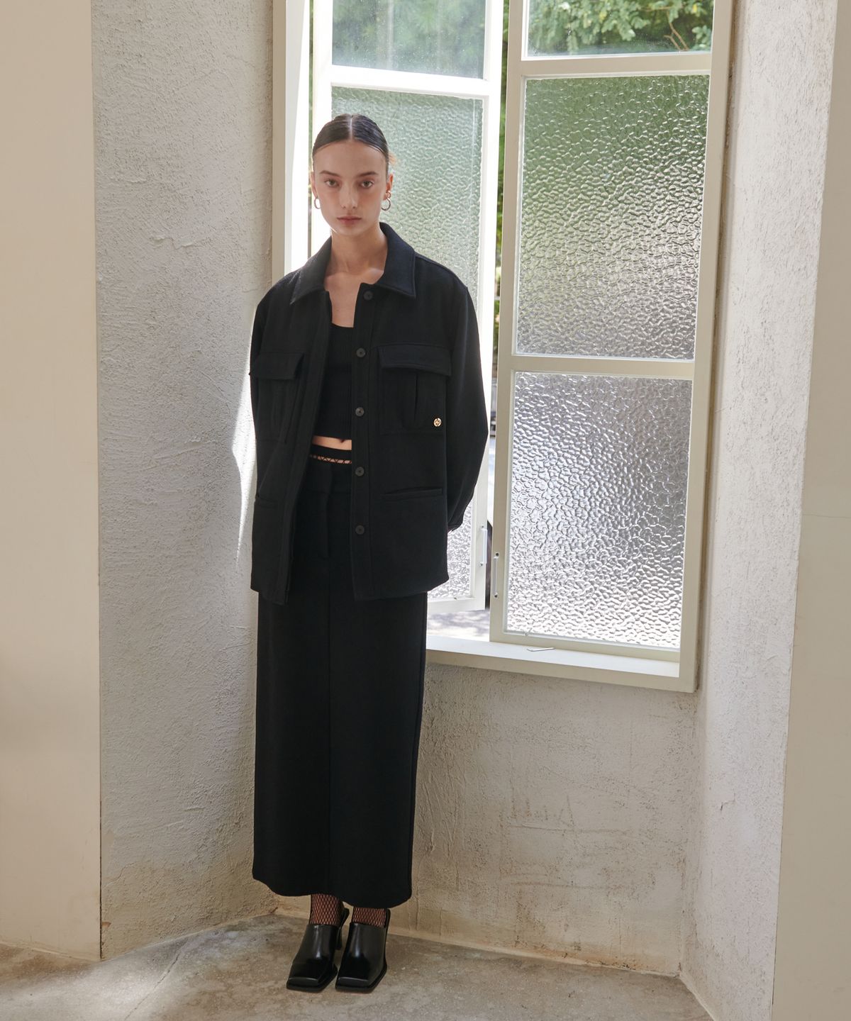 언뮤트(UNMUTE) SEMI LOW WAISTED MAXI WOOL SKIRT (BLACK)