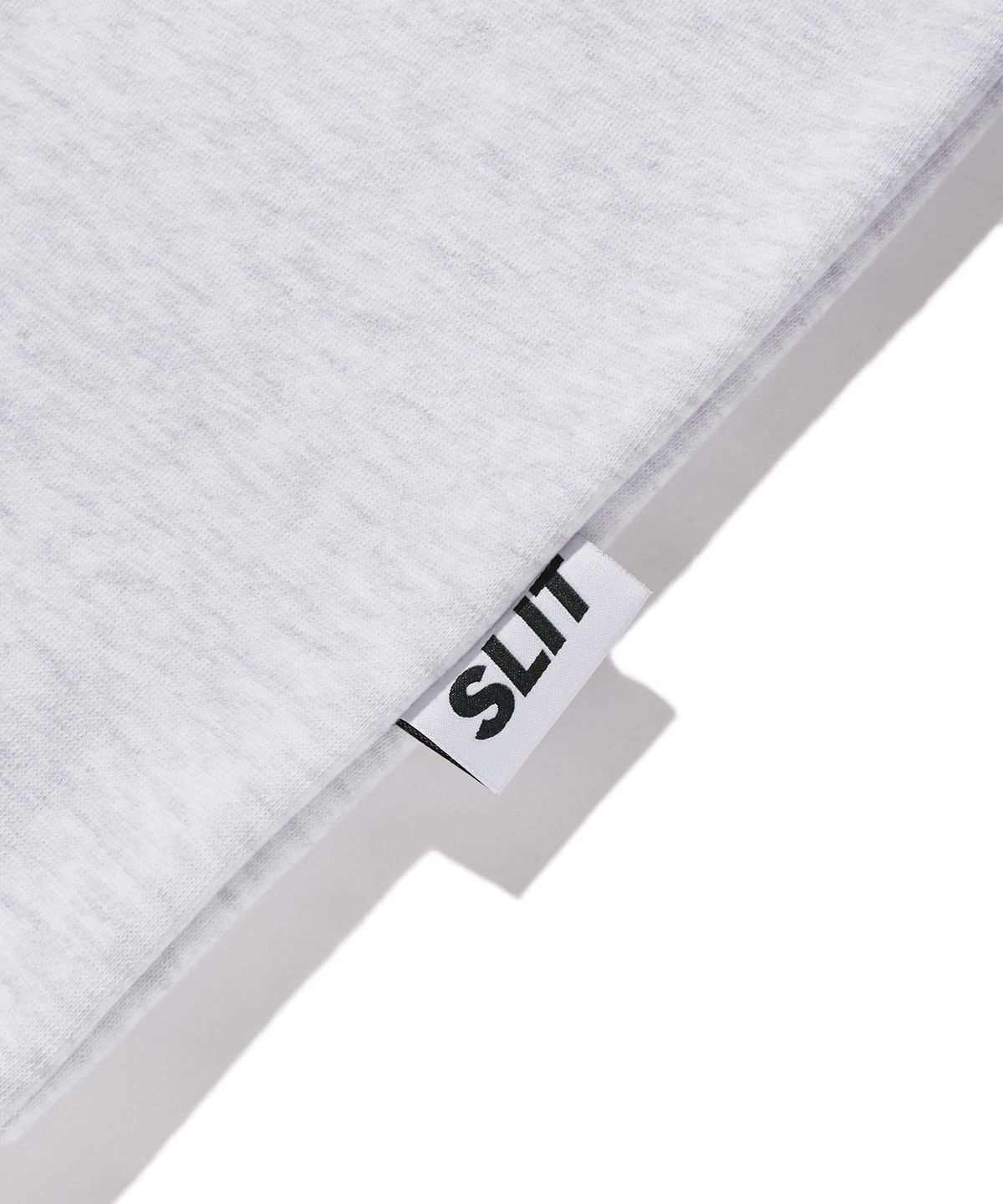 에스릿 스튜디오(SLIT STUDIO) 레터링 포켓 기모 스웨트 셔츠 화이트 멜란지