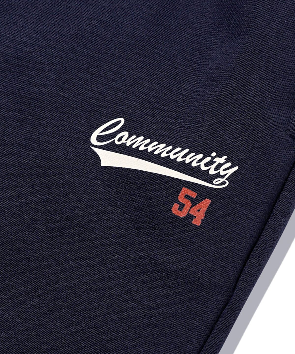 더마일(THEMILE) COMMUNITY 54 SWEAT PANTS[NAVY]