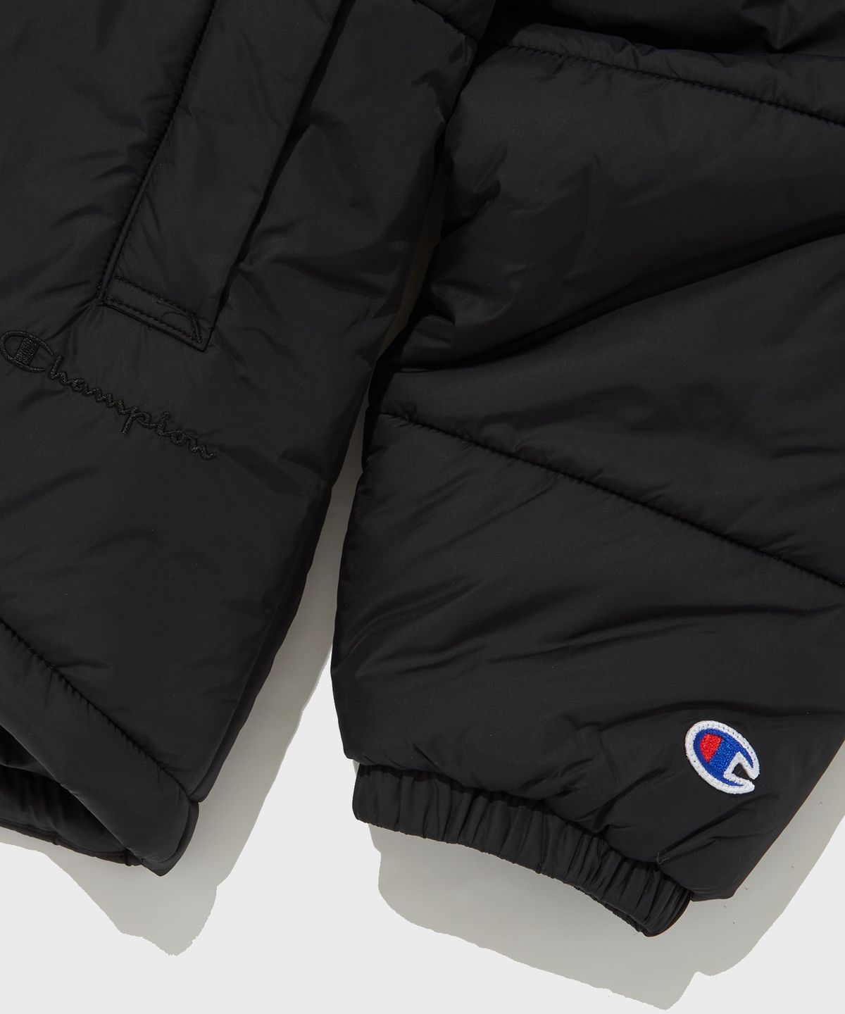 챔피온(CHAMPION) 여성 언발란스 타프타 패딩 자켓 Black