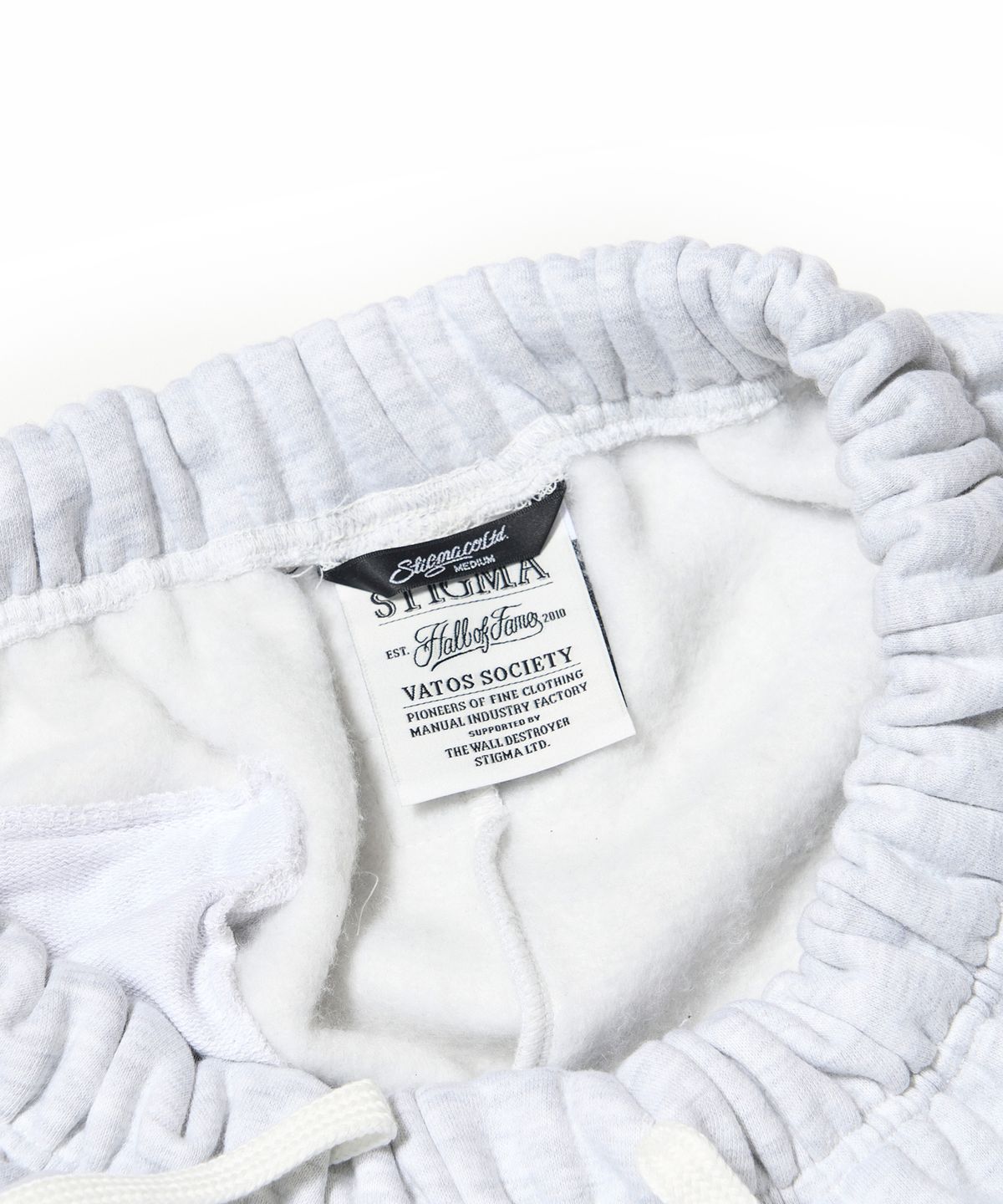스티그마(STIGMA) ZIPPER WIDE JOGGER PANTS WHITE MELANGE