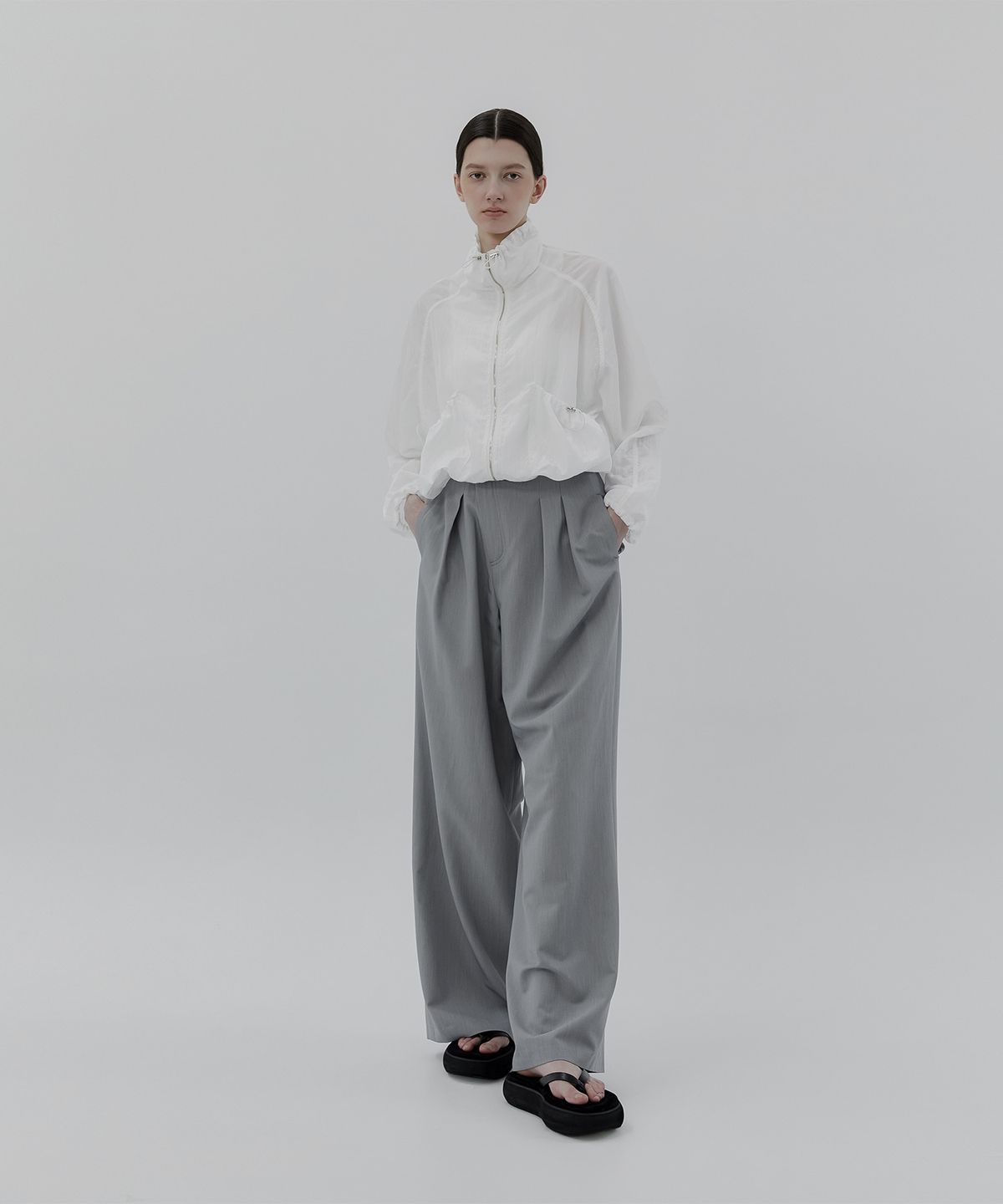 트리밍버드(TREEMINGBIRD) Oblique Fly Pintuck Trouser [ Light Blue Gray ]