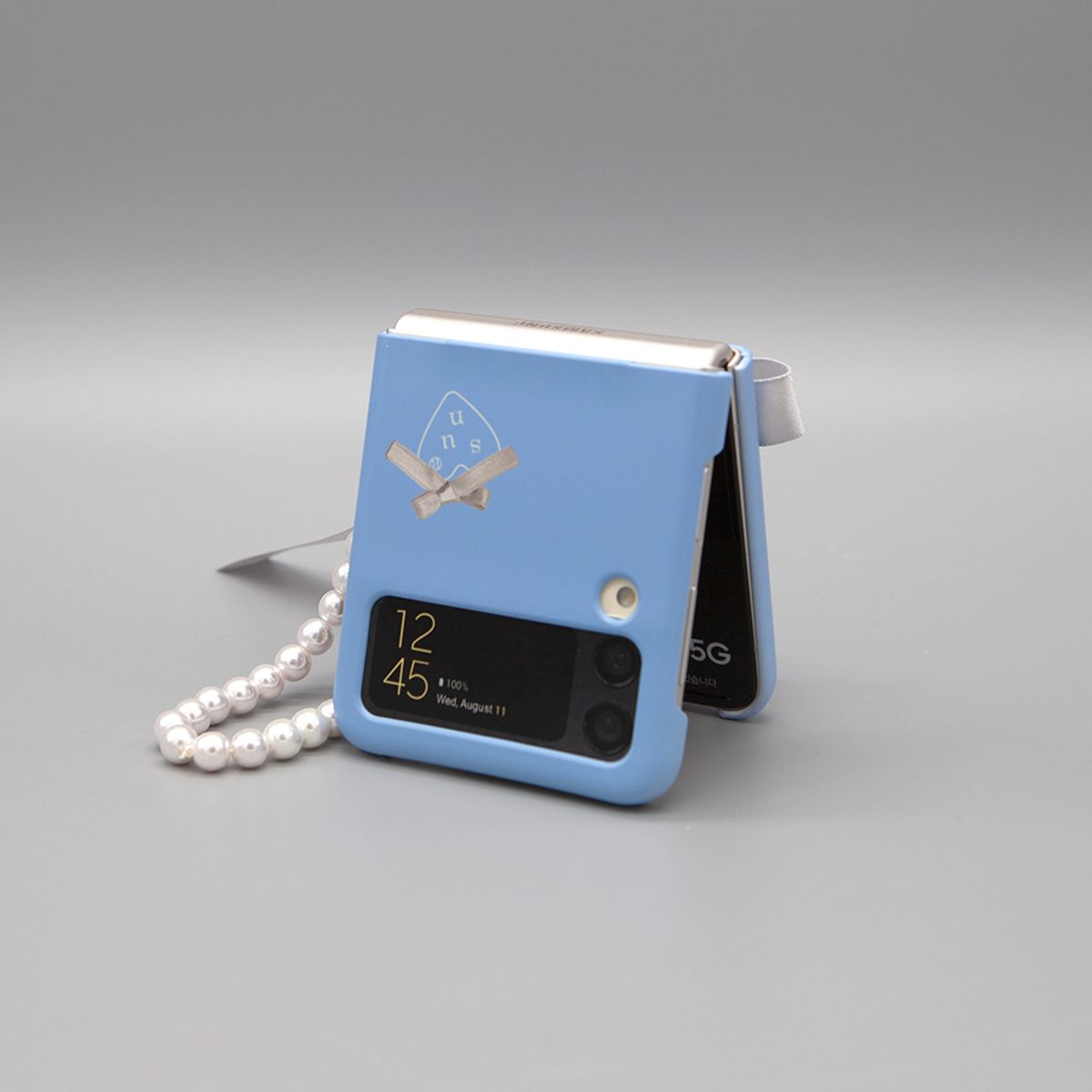 세컨드유니크네임(SECOND UNIQUE NAME) SUN CASE BALLET RIBBON SILVER (Z FLIP)