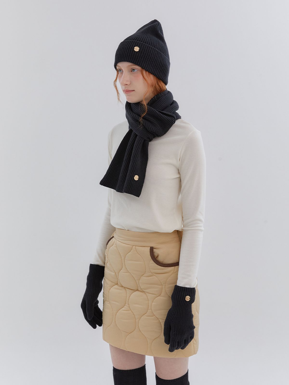 아노에틱(ANOETIC) WAVE LINE QUILTING SKIRT_BEIGE