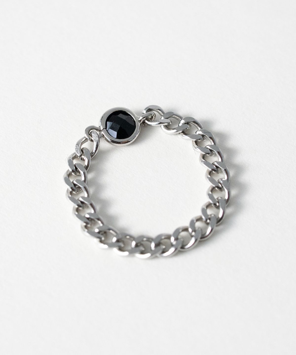 메리모티브(MERRYMOTIVE) Black crystal pendant surgical chain ring