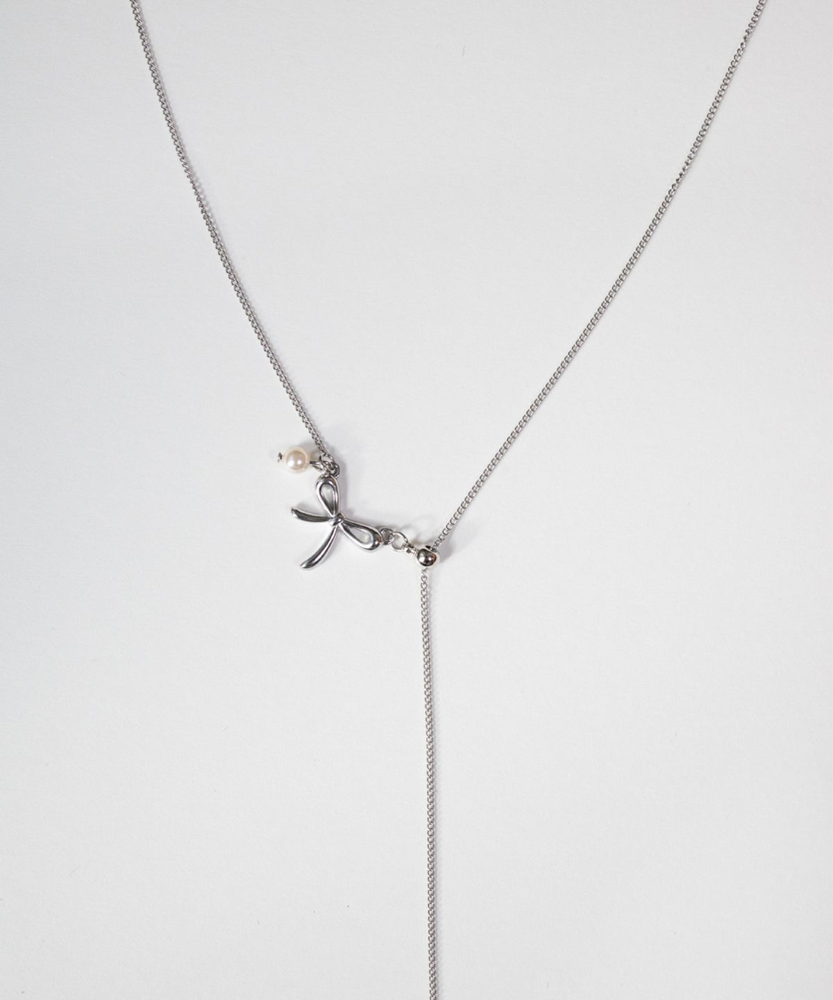 메리모티브(MERRYMOTIVE) Bow point long surgical necklace