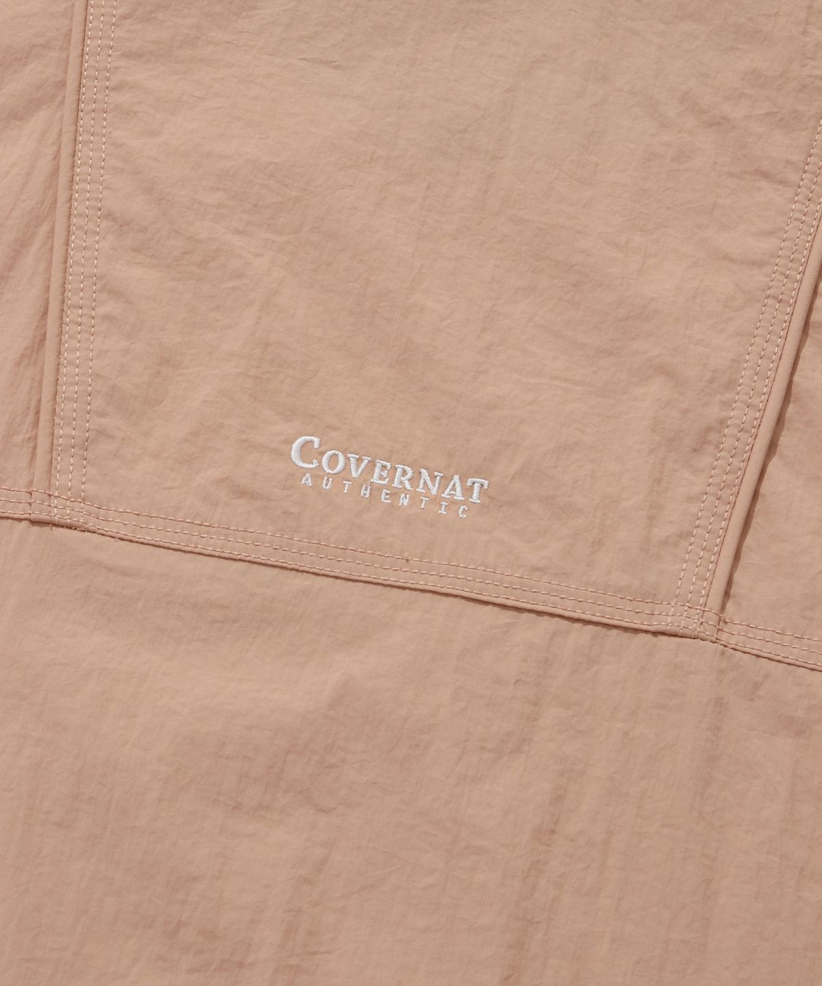 커버낫(COVERNAT) 컴피 나일론 윈드브레이커 점퍼 새먼