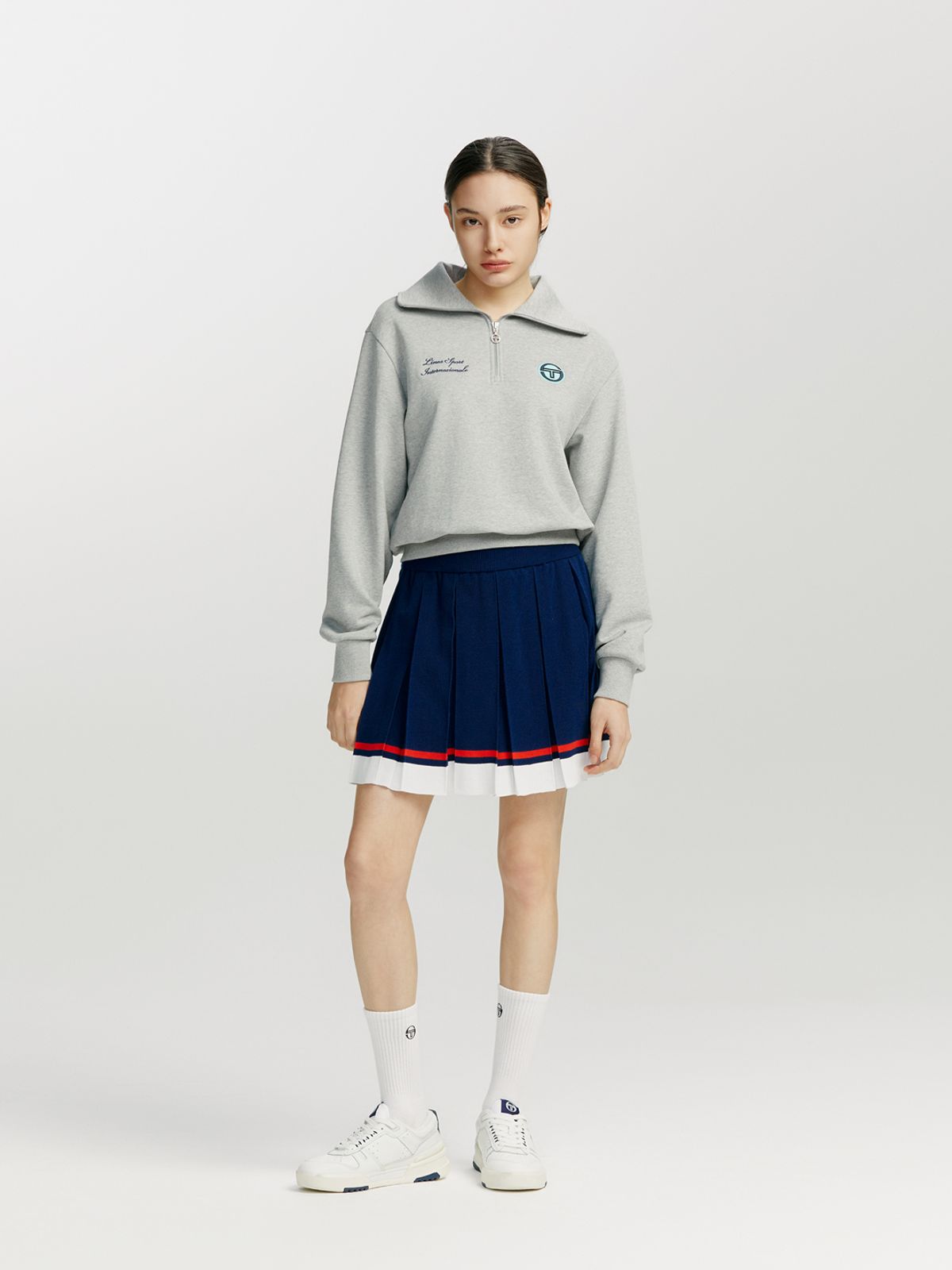 세르지오 타키니(SERGIO TACCHINI) W 프레피 니트 밑단 배색 플리츠 스커트 (Navy)