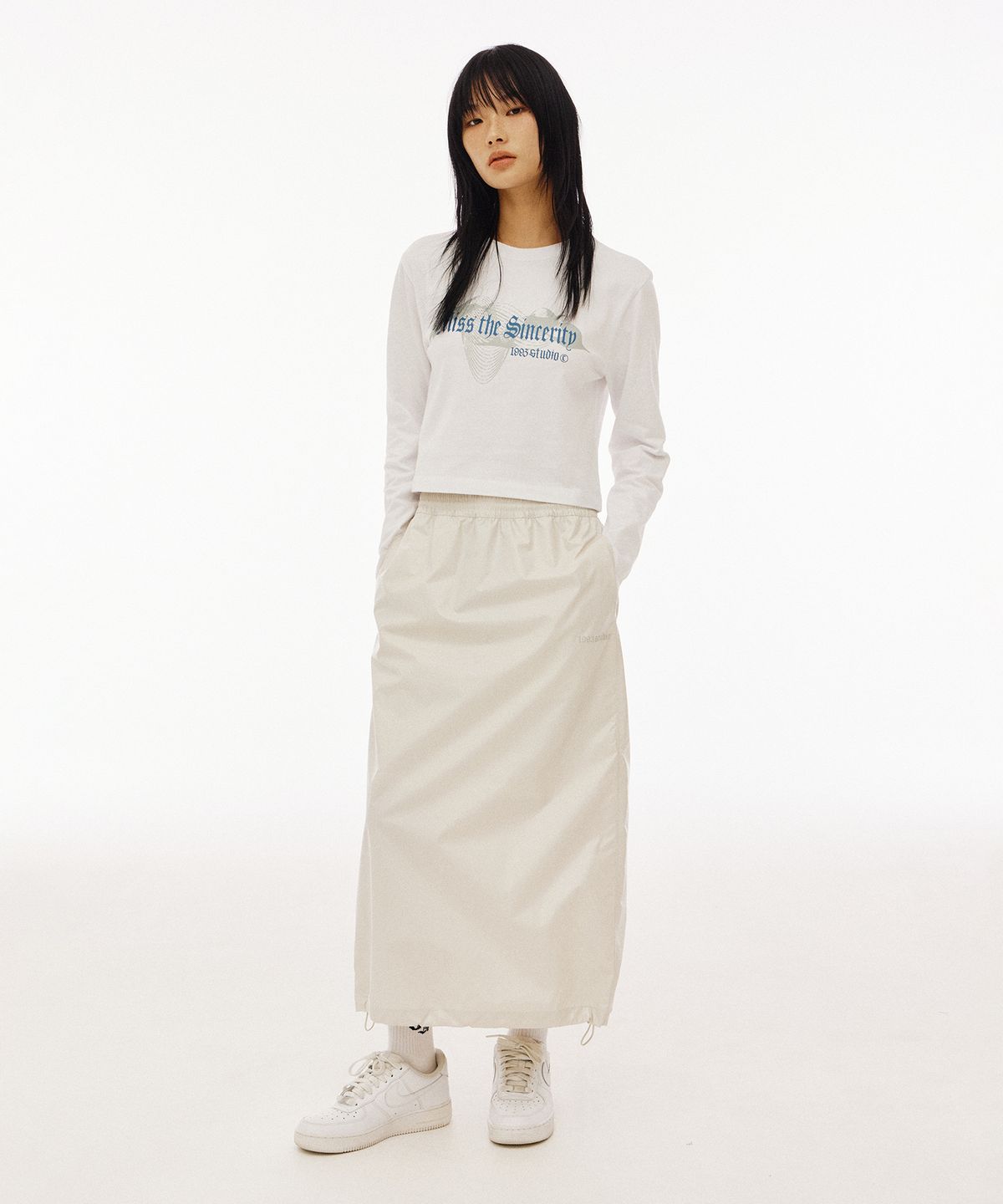 1993스튜디오(1993STUDIO) 글로시 스트링 롱 스커트_크림