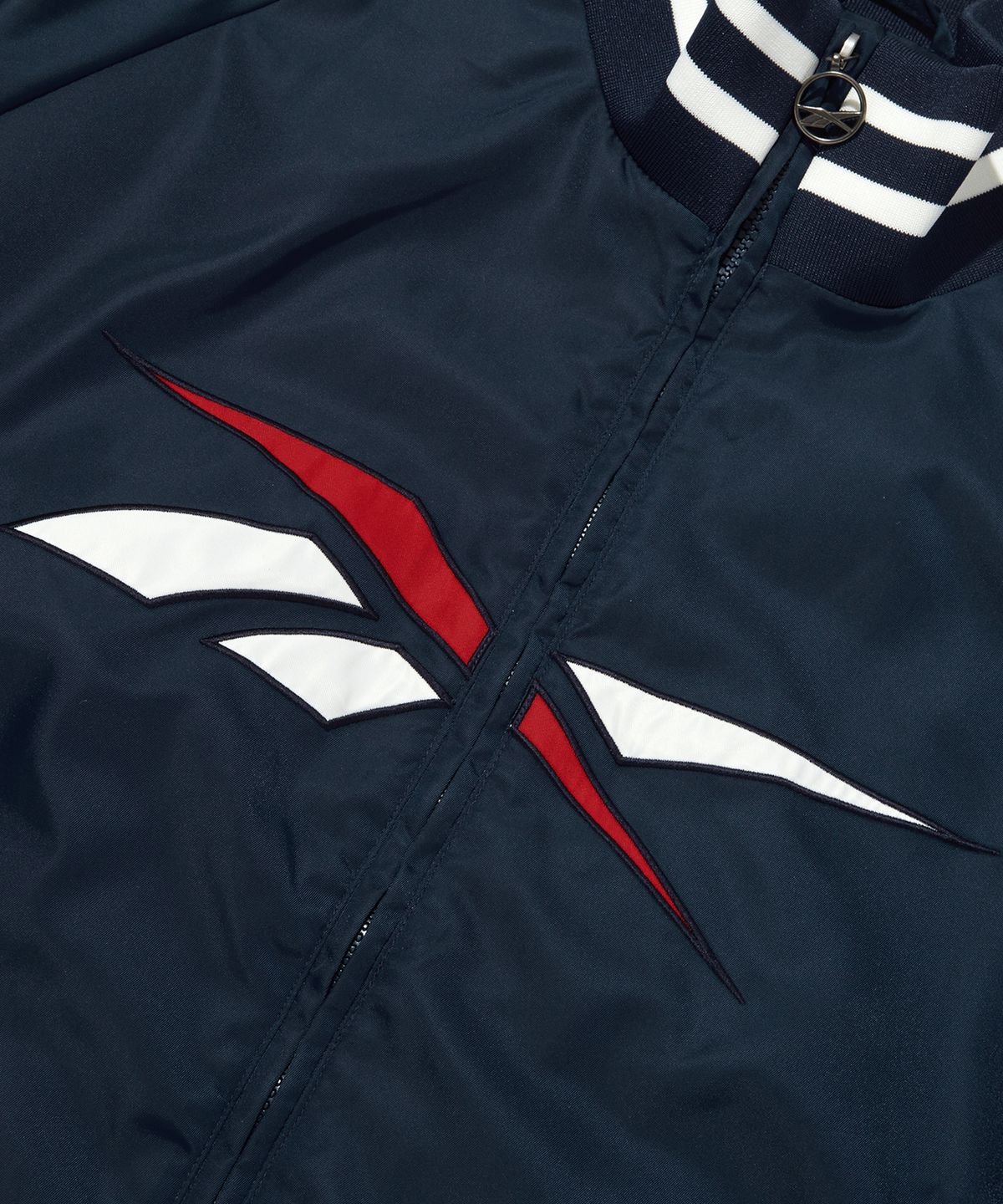 리복(REEBOK) 벡터 스타디움 바시티 자켓 - 네이비