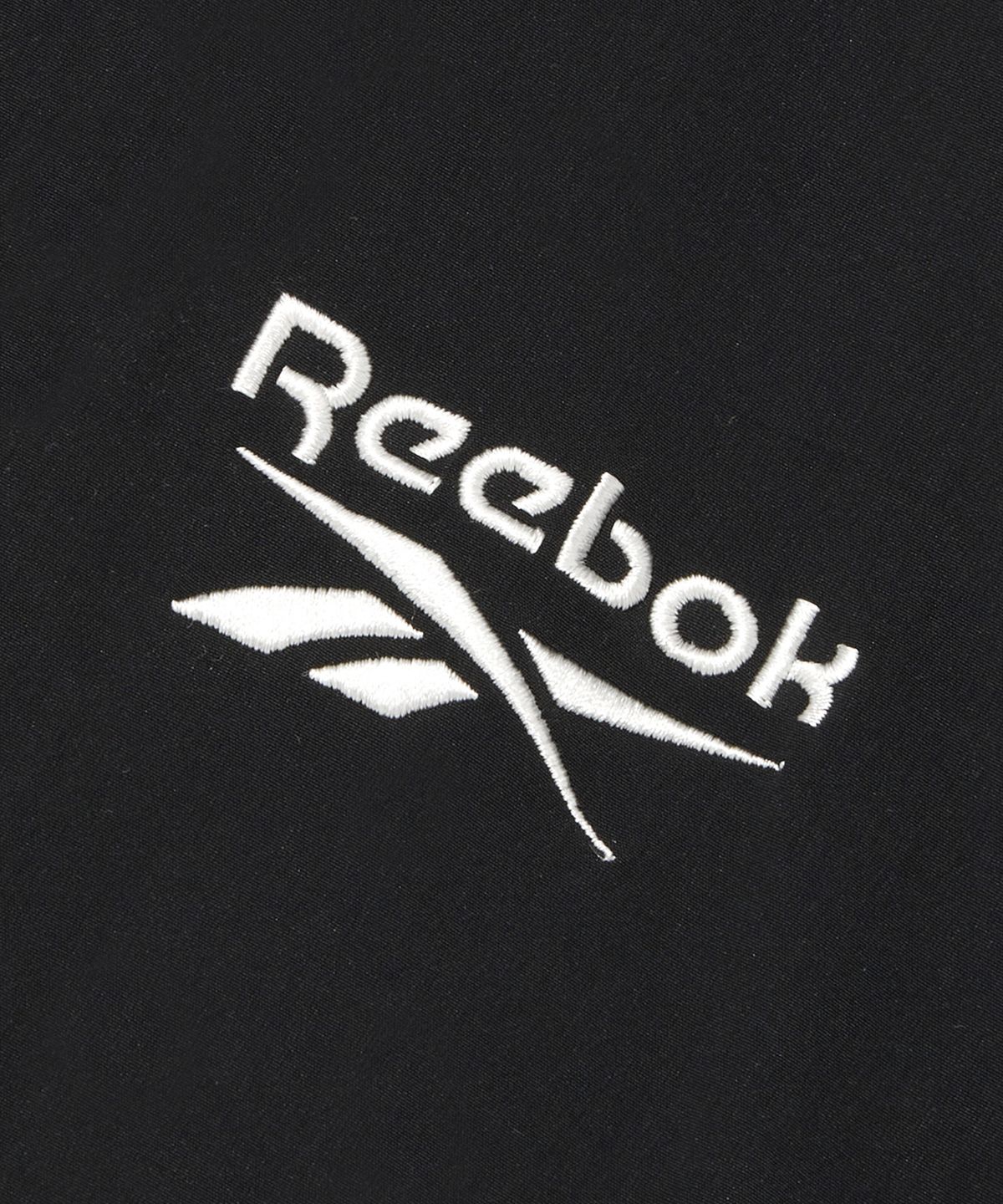 리복(REEBOK) 스트레치 후드 윈드 브레이커 - 블랙