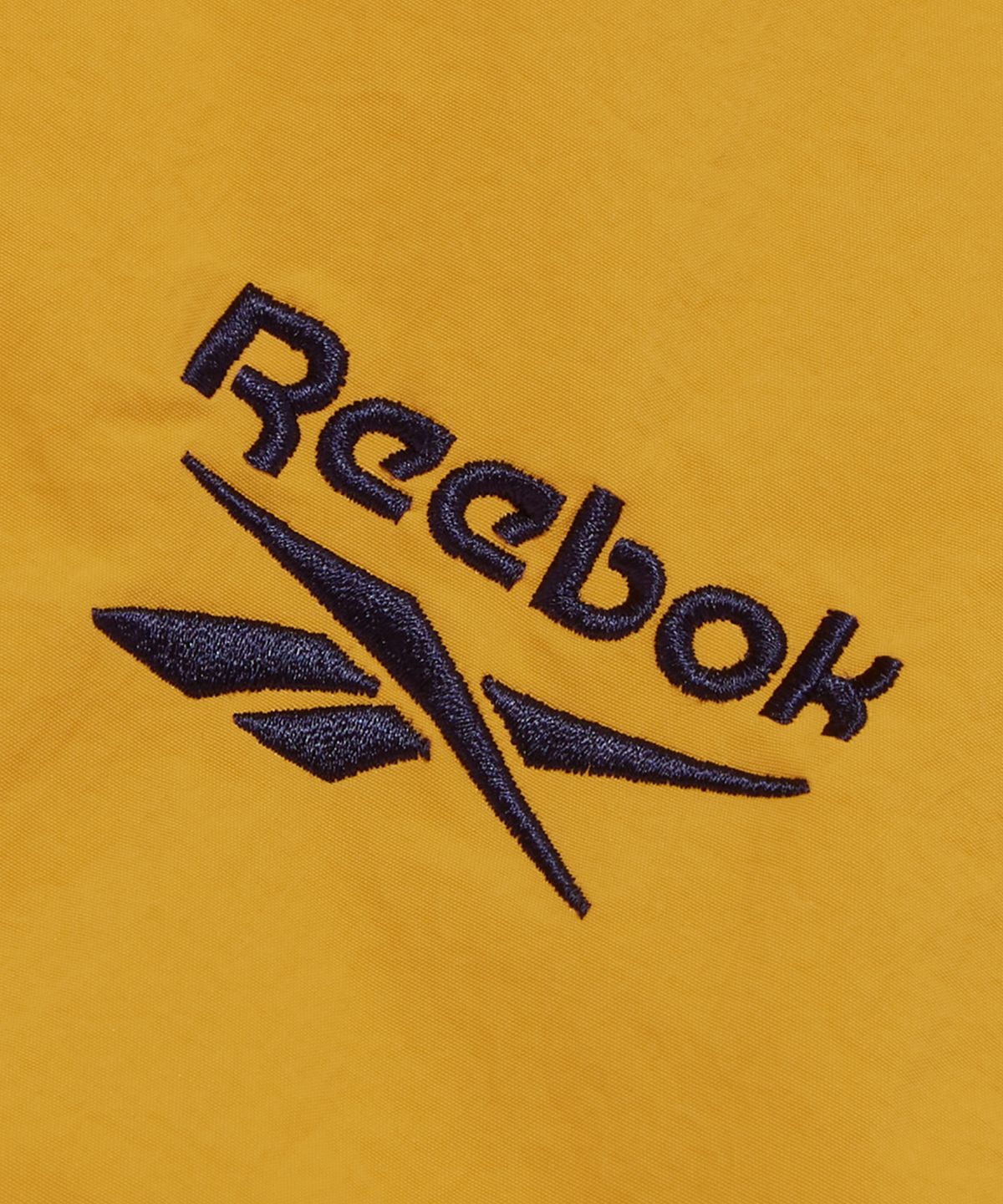 리복(REEBOK) 레전드 웜업 윈드 브레이커 - 옐로우:네이비