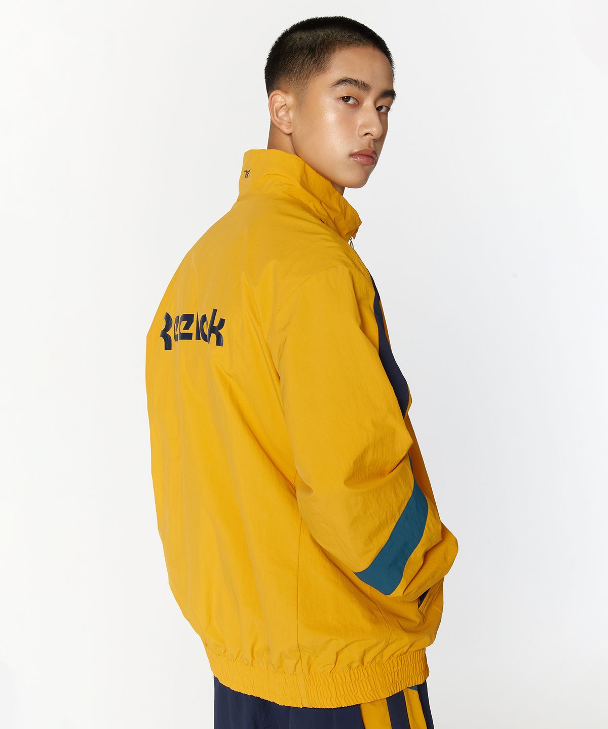 리복(REEBOK) 레전드 웜업 윈드 브레이커 - 옐로우:네이비
