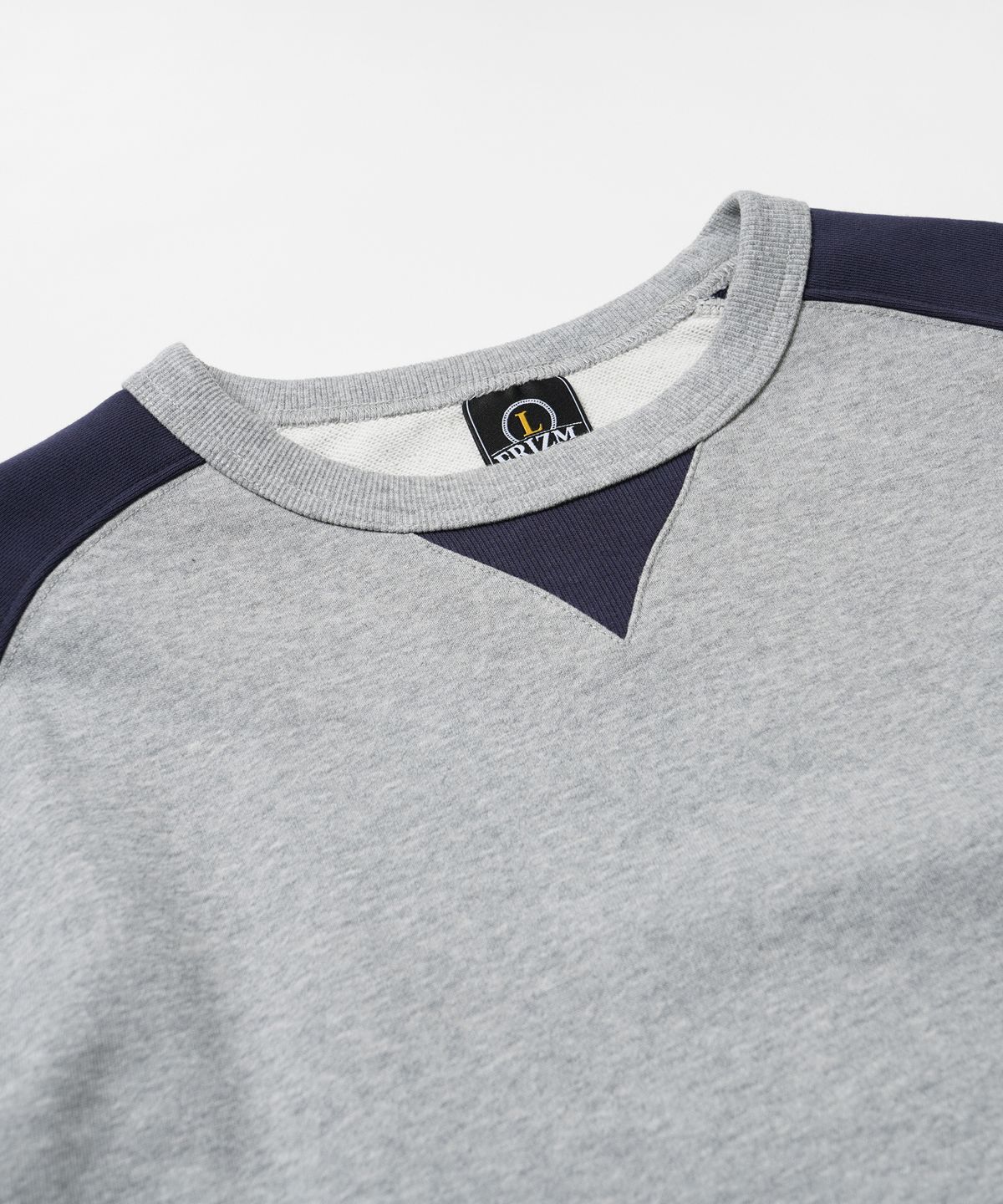 프리즘웍스(FRIZMWORKS) ROUNDED RAGLAN SWEATSHIRT _ NAVY