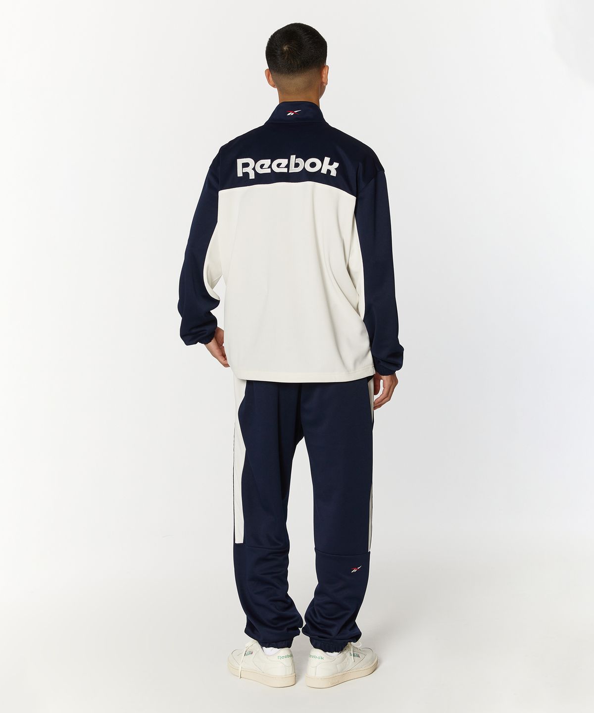 리복(REEBOK) 웜업 트랙탑 - 오프 화이트:네이비