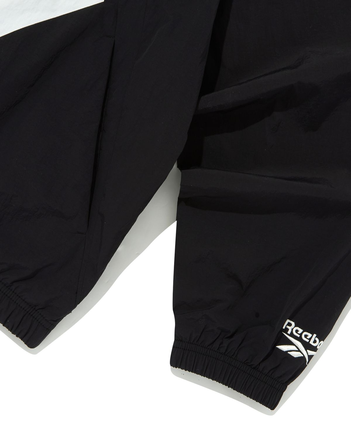리복(REEBOK) 벡터 플래시 윈드 브레이커 - 블랙