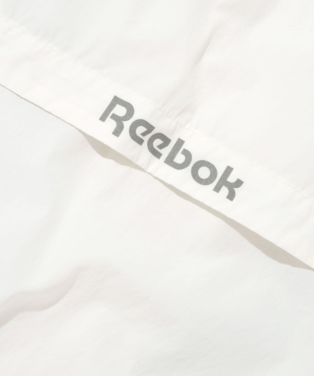 리복(REEBOK) 벡터 플래시 윈드 브레이커 - 오프 화이트