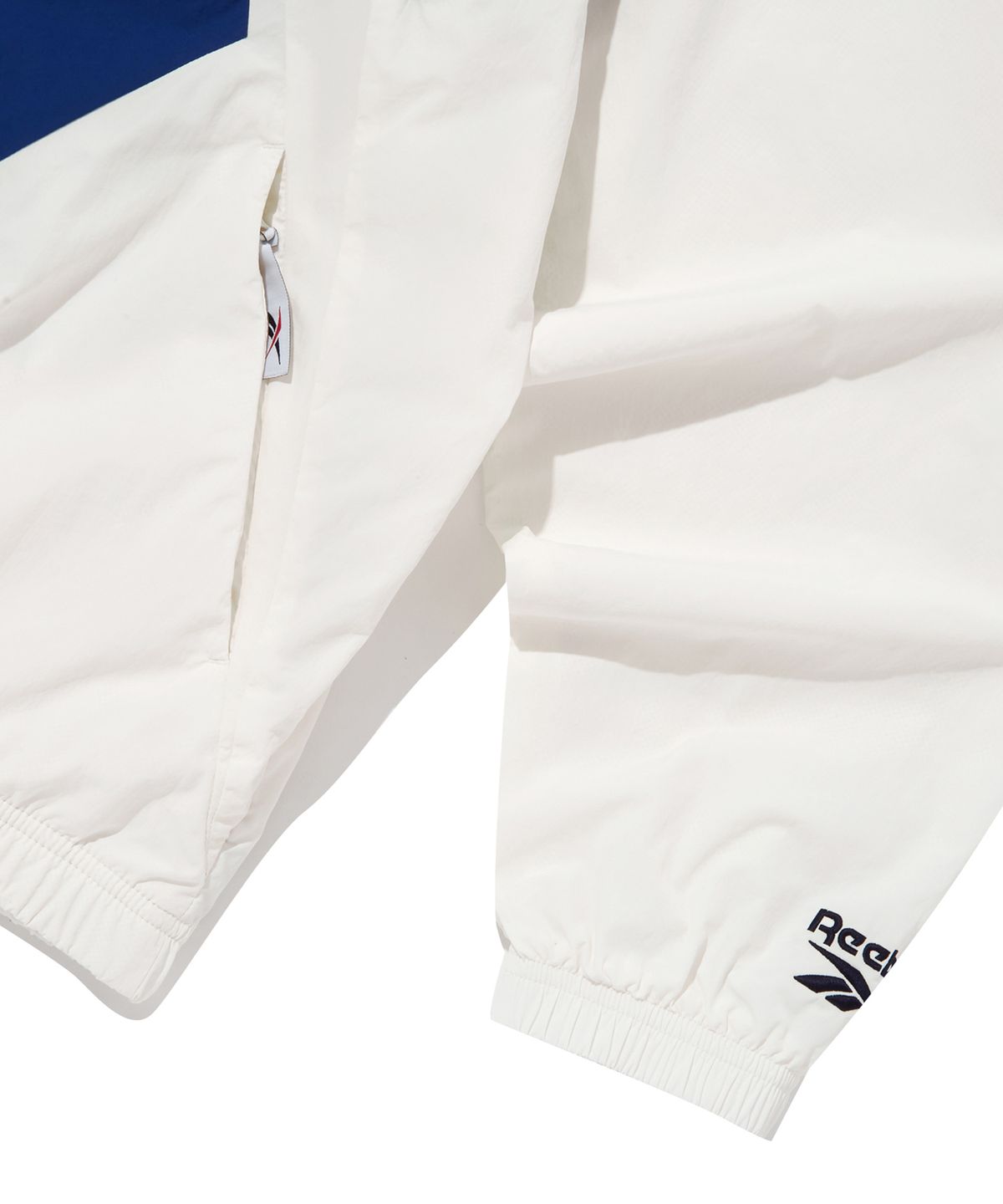 리복(REEBOK) 벡터 플래시 윈드 브레이커 - 오프 화이트