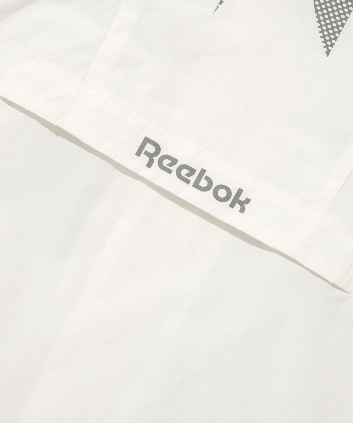 리복(REEBOK) 벡터 플래시 크롭 윈드 브레이커 (W) - 오프 화이트