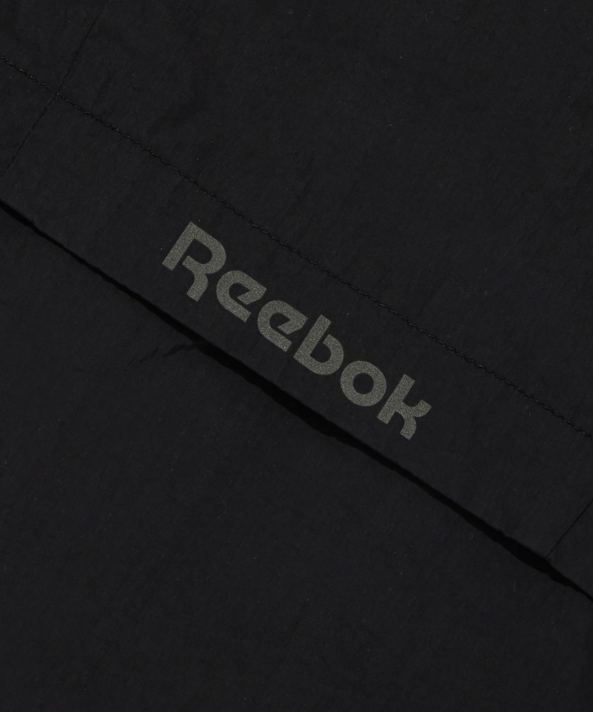 리복(REEBOK) 벡터 플래시 크롭 윈드 브레이커 (W) - 블랙