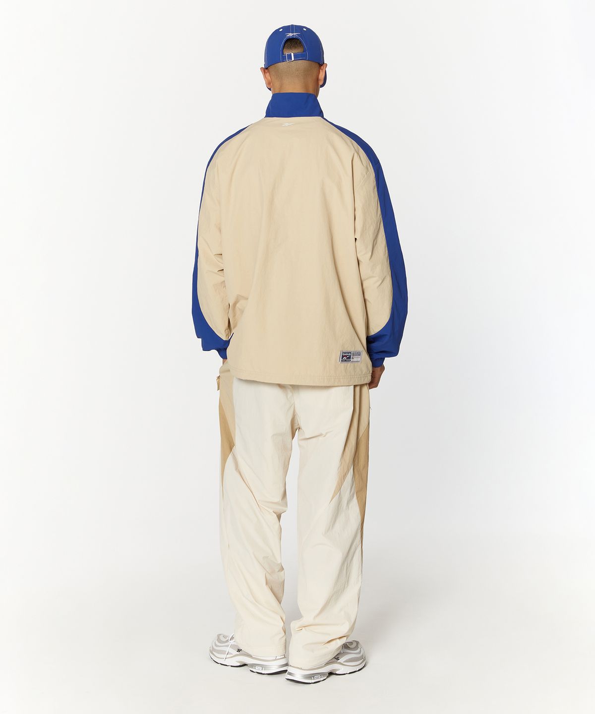 리복(REEBOK) 벡터 플래시 2WAY 웜업 팬츠 - 베이지