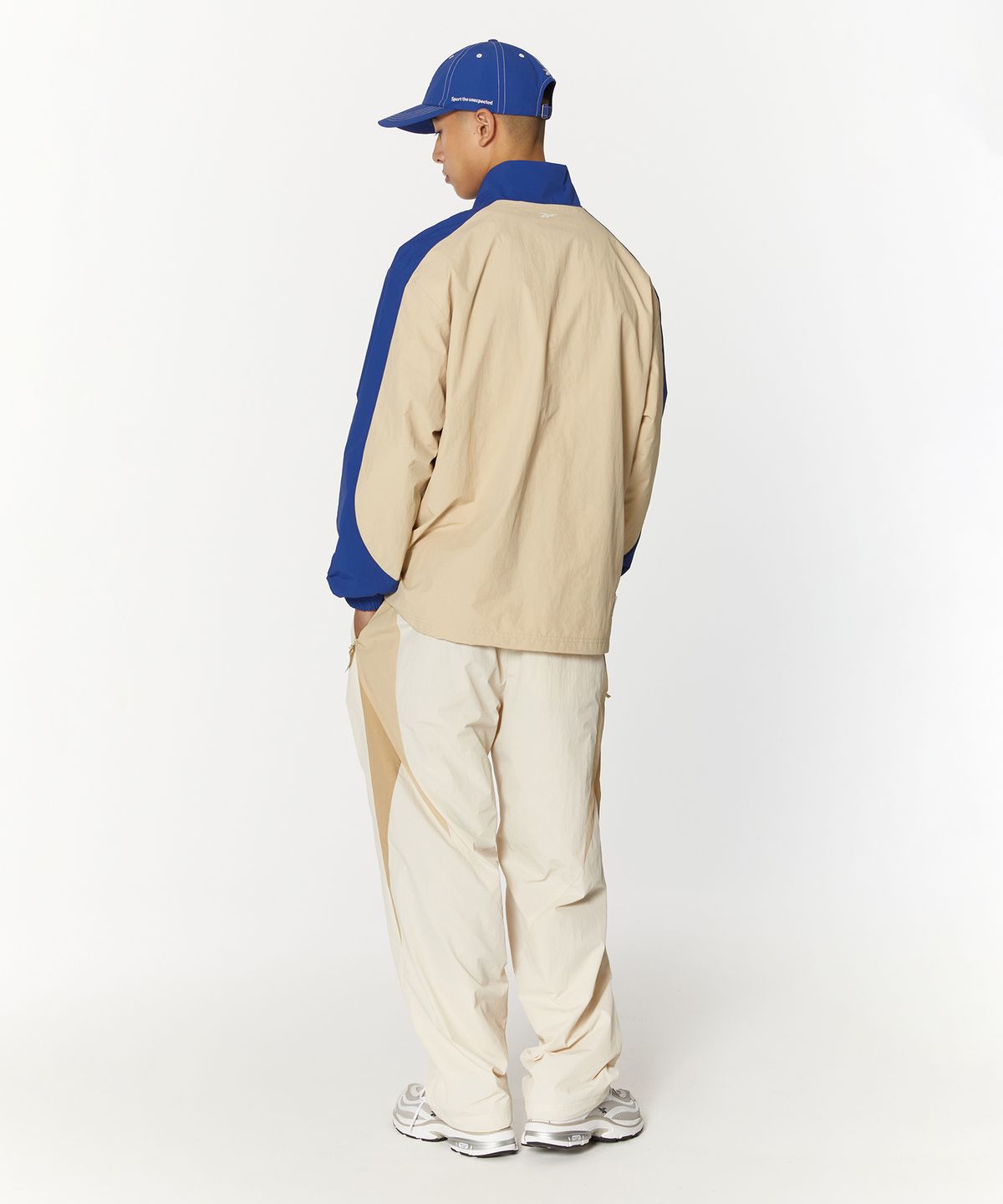 리복(REEBOK) 벡터 플래시 2WAY 웜업 팬츠 - 베이지