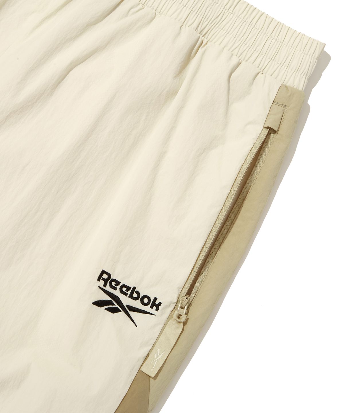 리복(REEBOK) 벡터 플래시 2WAY 웜업 팬츠 - 베이지