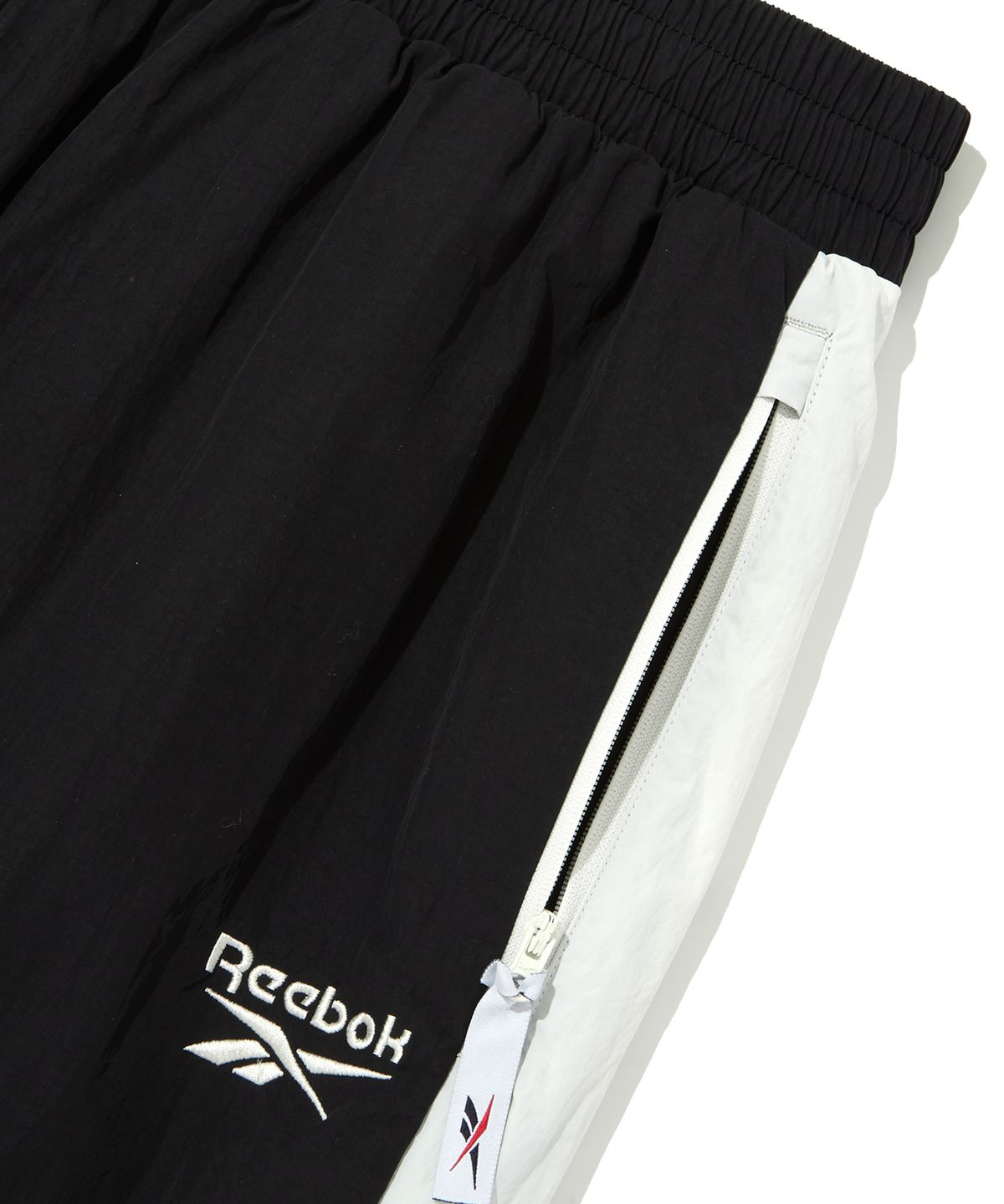 리복(REEBOK) 벡터 플래시 2WAY 웜업 팬츠 - 블랙