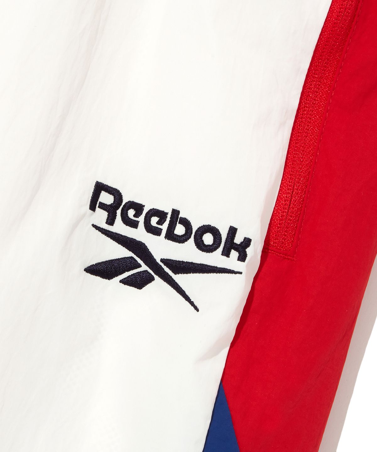 리복(REEBOK) 벡터 플래시 2WAY 웜업 팬츠 - 오프 화이트