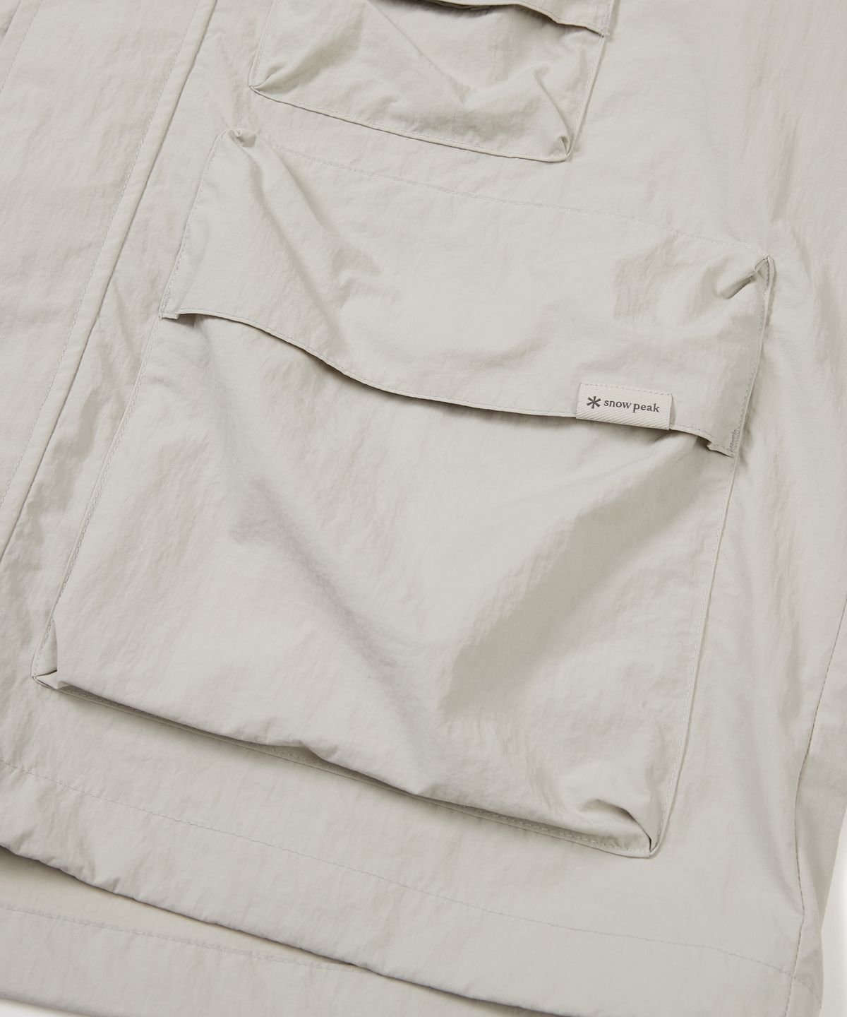 스노우피크 어패럴(SNOWPEAK APPAREL) 타슬란 우븐 유틸리티 바람막이 Light Beige (S24MMLWB56)