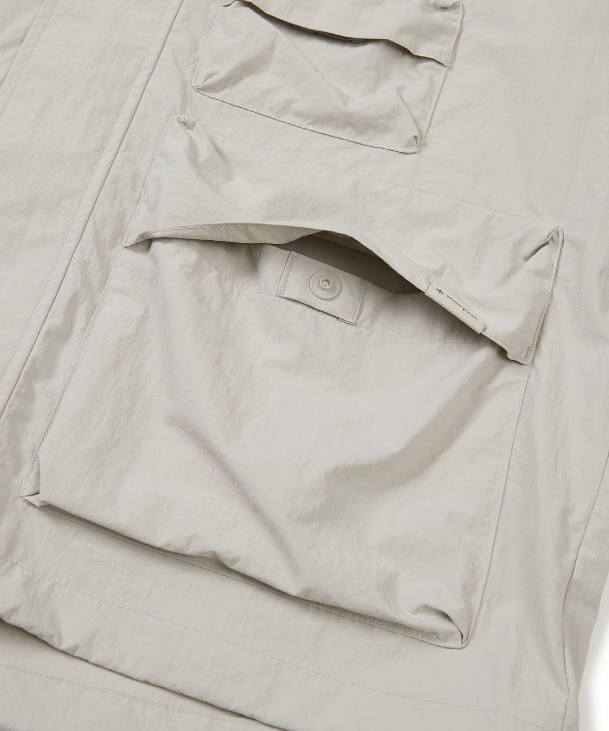 스노우피크 어패럴(SNOWPEAK APPAREL) 타슬란 우븐 유틸리티 바람막이 Light Beige (S24MMLWB56)