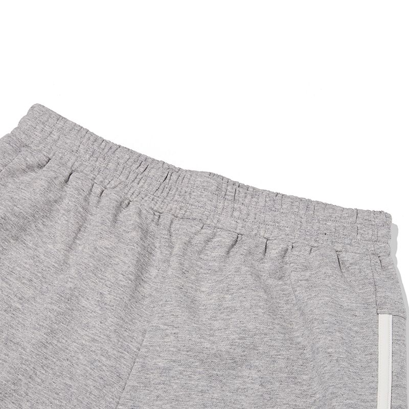 MUSINSA | KIRSH Wording graphic dolphin pants [melange gray]