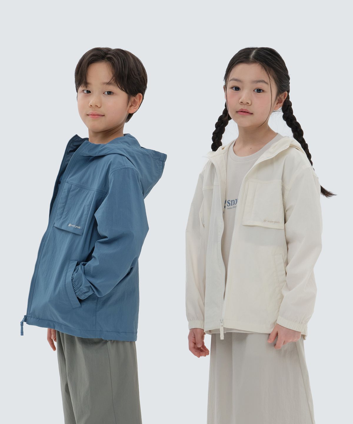 스노우피크 어패럴 키즈(SNOWPEAK APPAREL KIDS) 키즈 루트 아웃포켓 바람막이 Butter Ivory (S24MKRWB80)