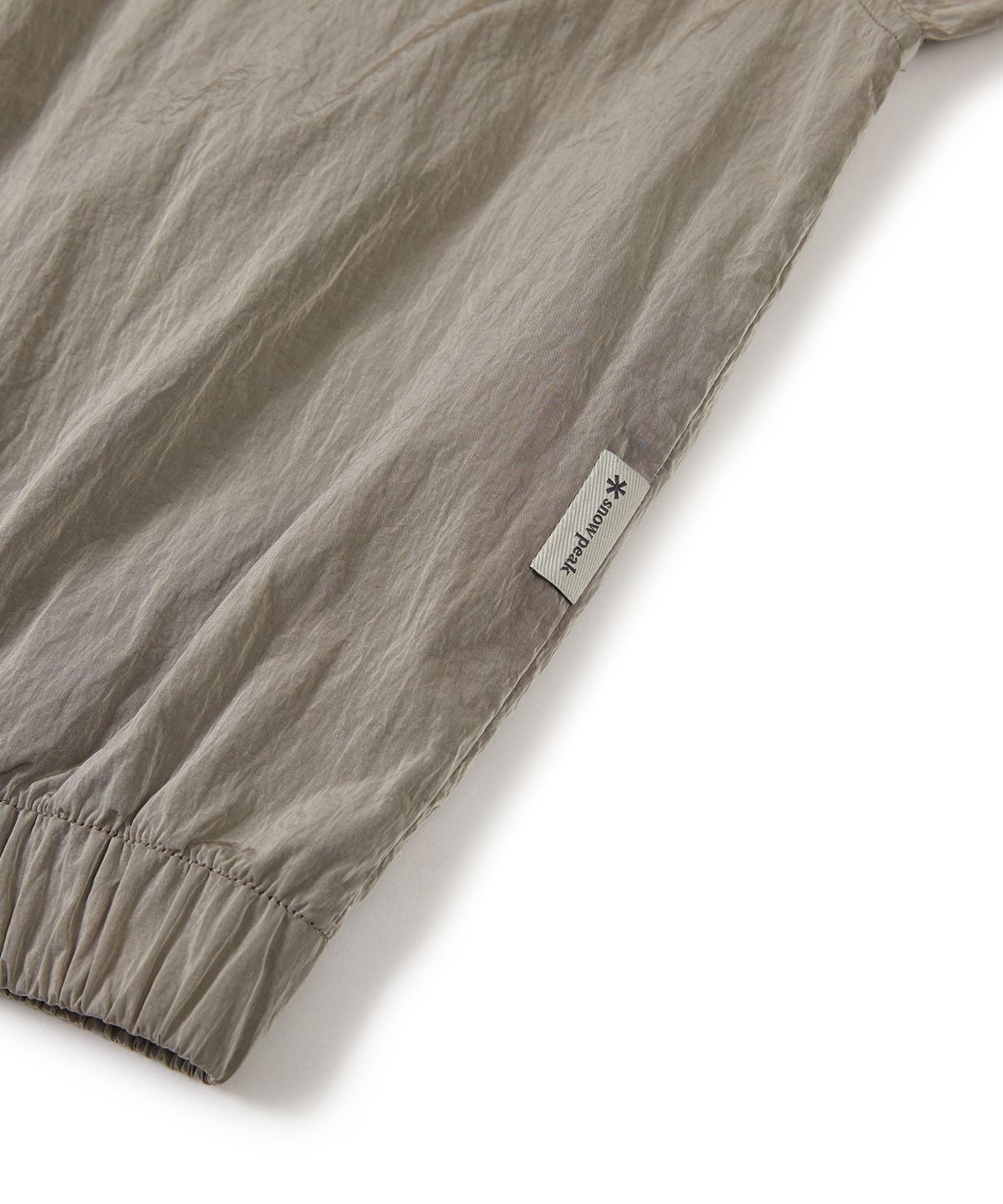 스노우피크 어패럴(SNOWPEAK APPAREL) 브라이트 여성 세미 크롭 바람막이 Tan Gray (S24MWFWB75)