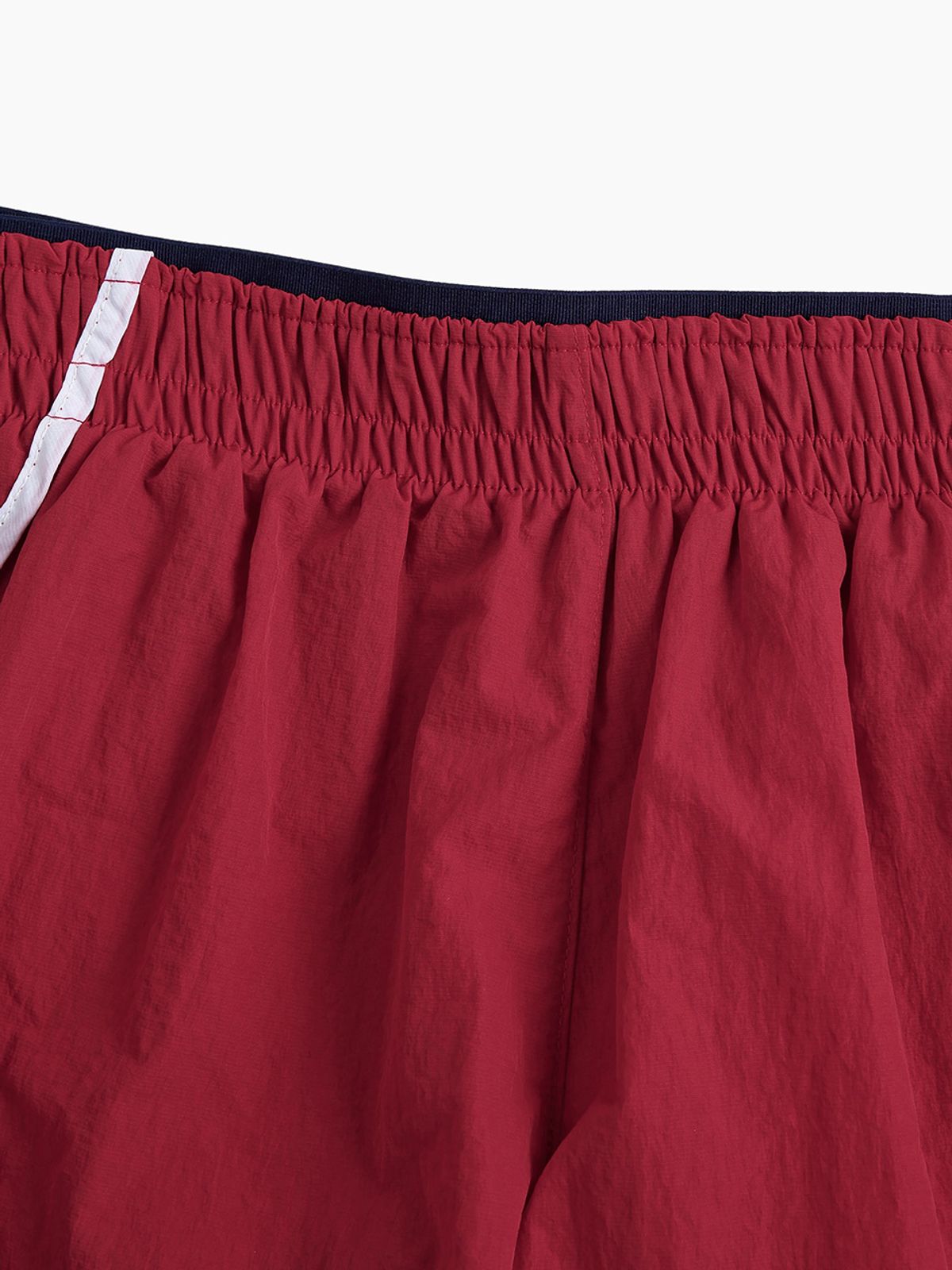 미나수(MENASOO) RUNNING TRACK NYLON SHORTS_RED