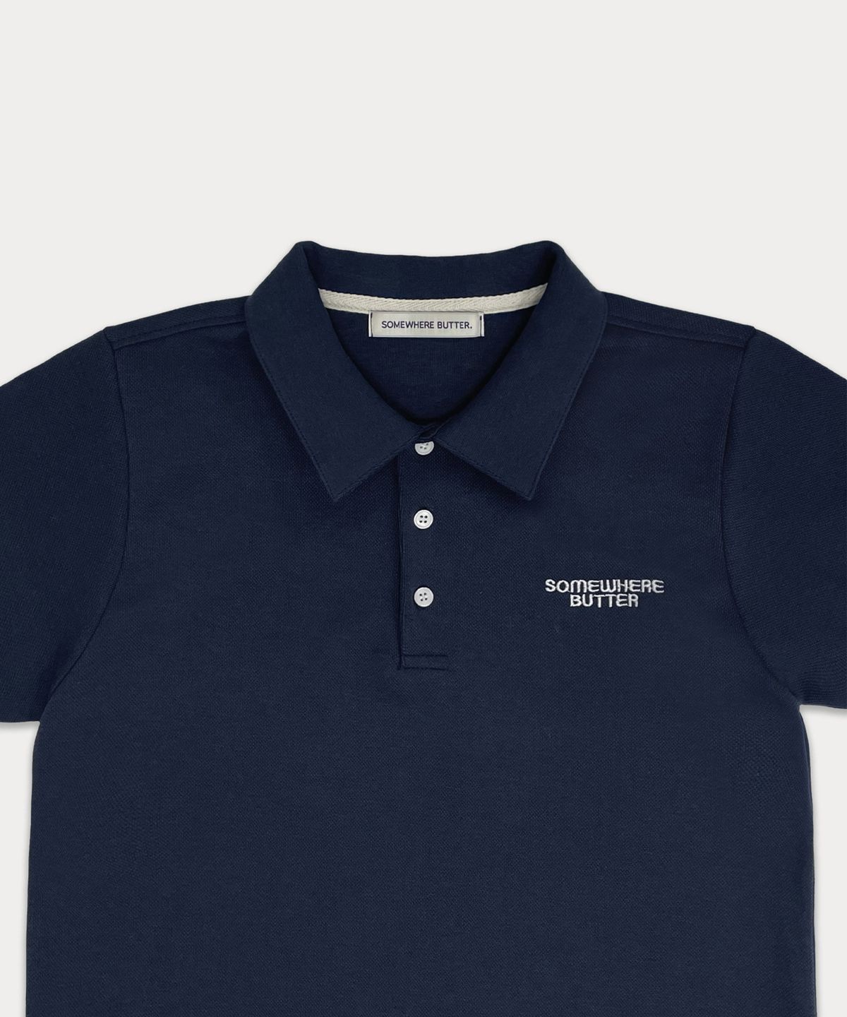 썸웨어버터(SOMEWHEREBUTTER) Classy logo pique top - navy
