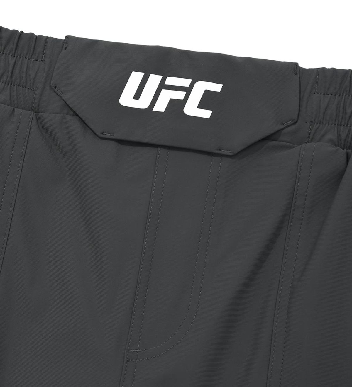유에프씨 스포츠(UFC SPORT) UFC 트리코트 레귤러핏 쇼츠 7인치 차콜 U4SPV2110CH
