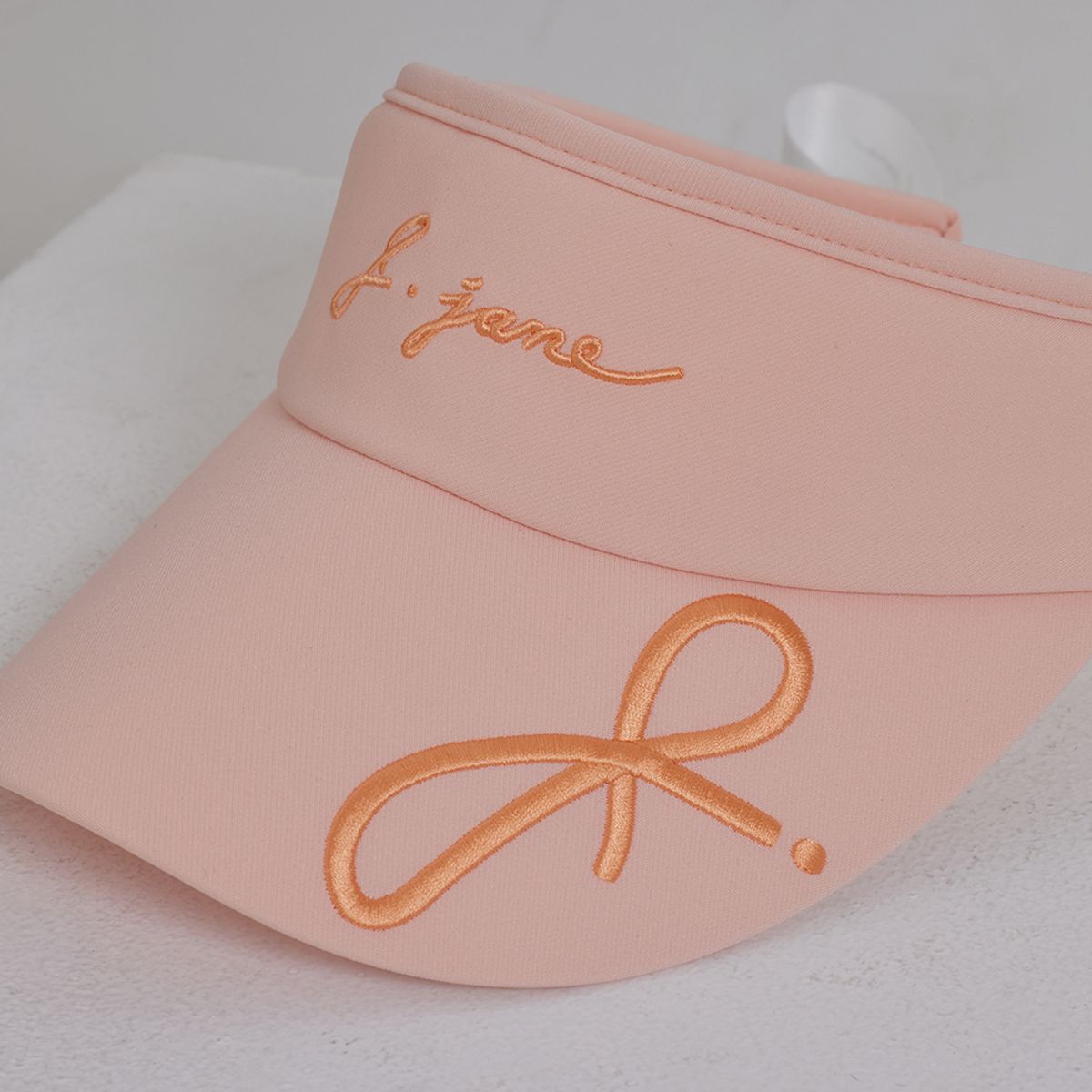 제이제인(J.JANE) 로고 리본 썬캡 (Peach)