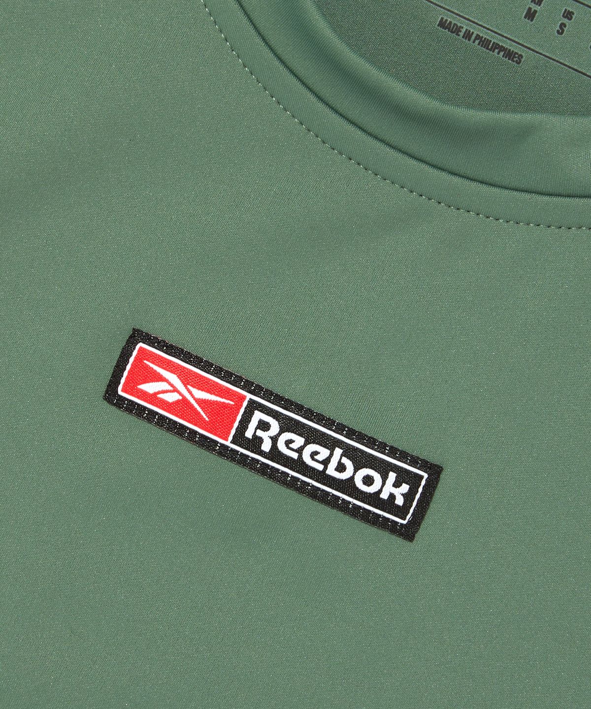 리복(REEBOK) 럭스 볼드 크롭 반팔 티셔츠 (W) - 올리브 / 100076117