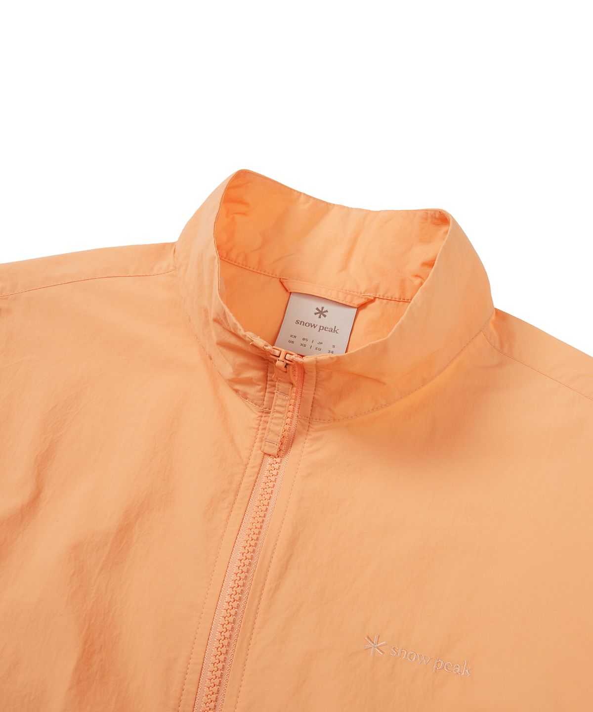 스노우피크 어패럴(SNOWPEAK APPAREL) 타슬란 여성 우븐 스탠드넥 바람막이 Light Orange (S24MWLWB51)