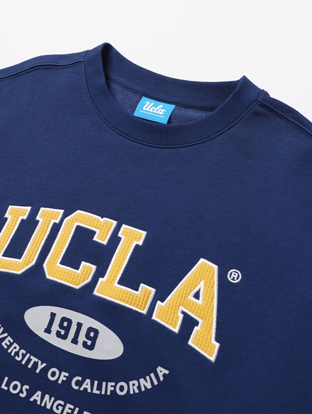 유씨엘에이(UCLA) 남여공용 프린트 자수 믹스 오버핏 쮸리 스웨트셔츠DK-BLUE](UA3LT82_A4)