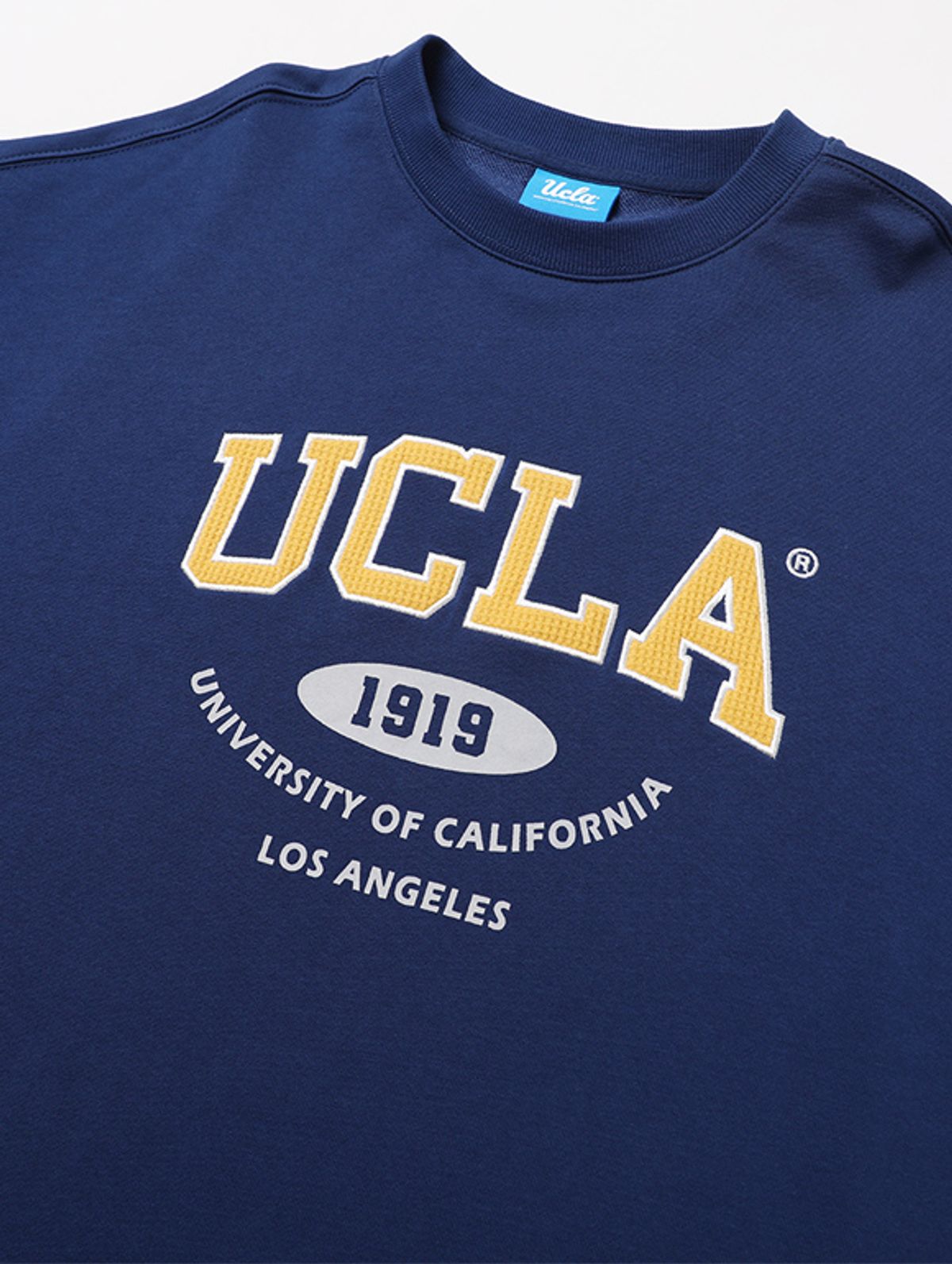 유씨엘에이(UCLA) 남여공용 프린트 자수 믹스 오버핏 쮸리 스웨트셔츠DK-BLUE](UA3LT82_A4)