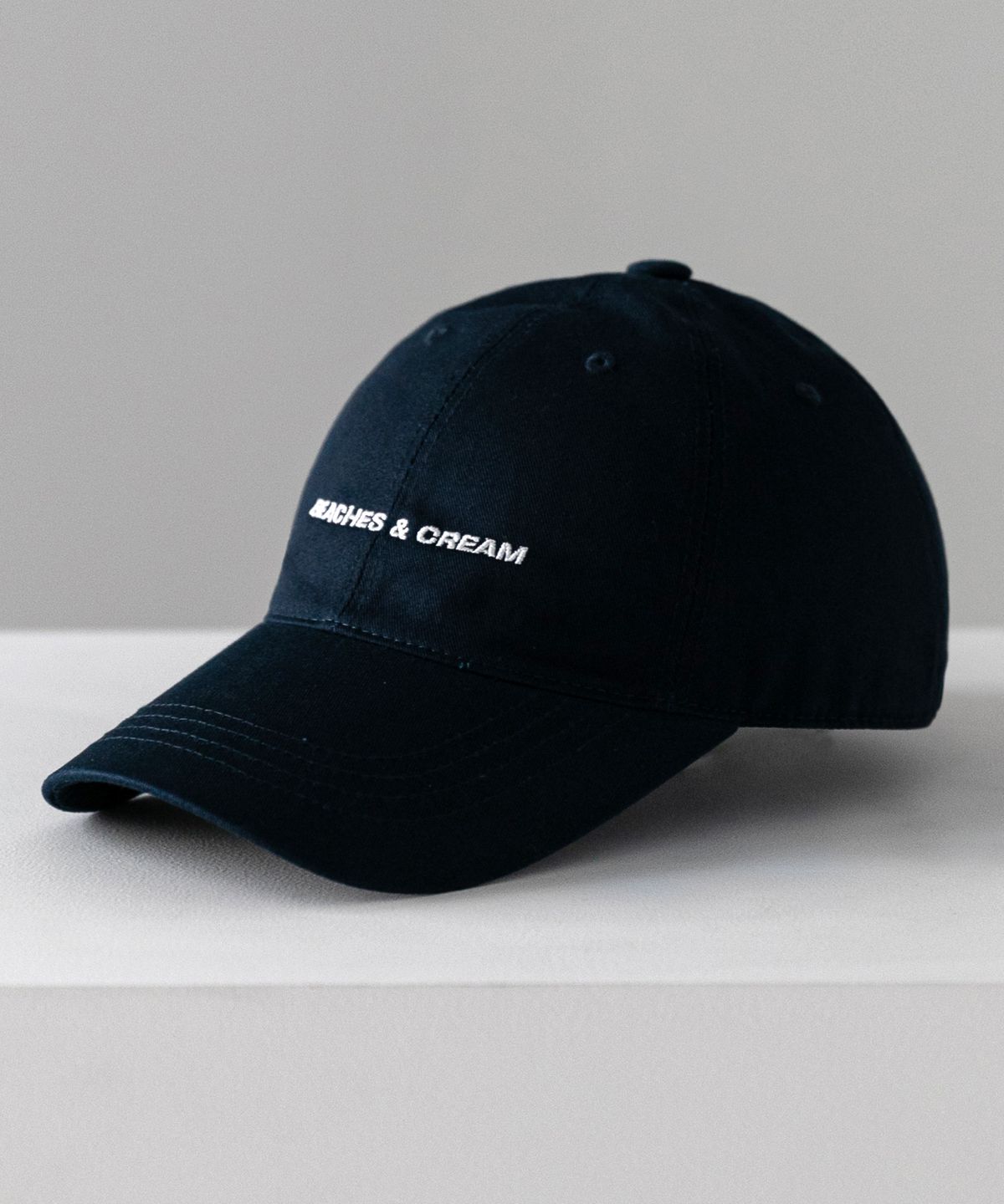비치스앤크림(BEACHESANDCREAM) SMALL LOGO BALL CAP-NAVY
