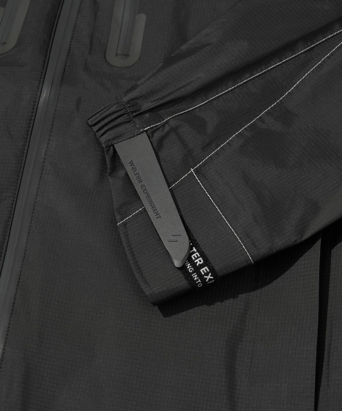 웰터 익스페리먼트(WELTER EXPERIMENT) 3LAYER REFLECTIVE STITCH JACKET_BLACK_WOL055