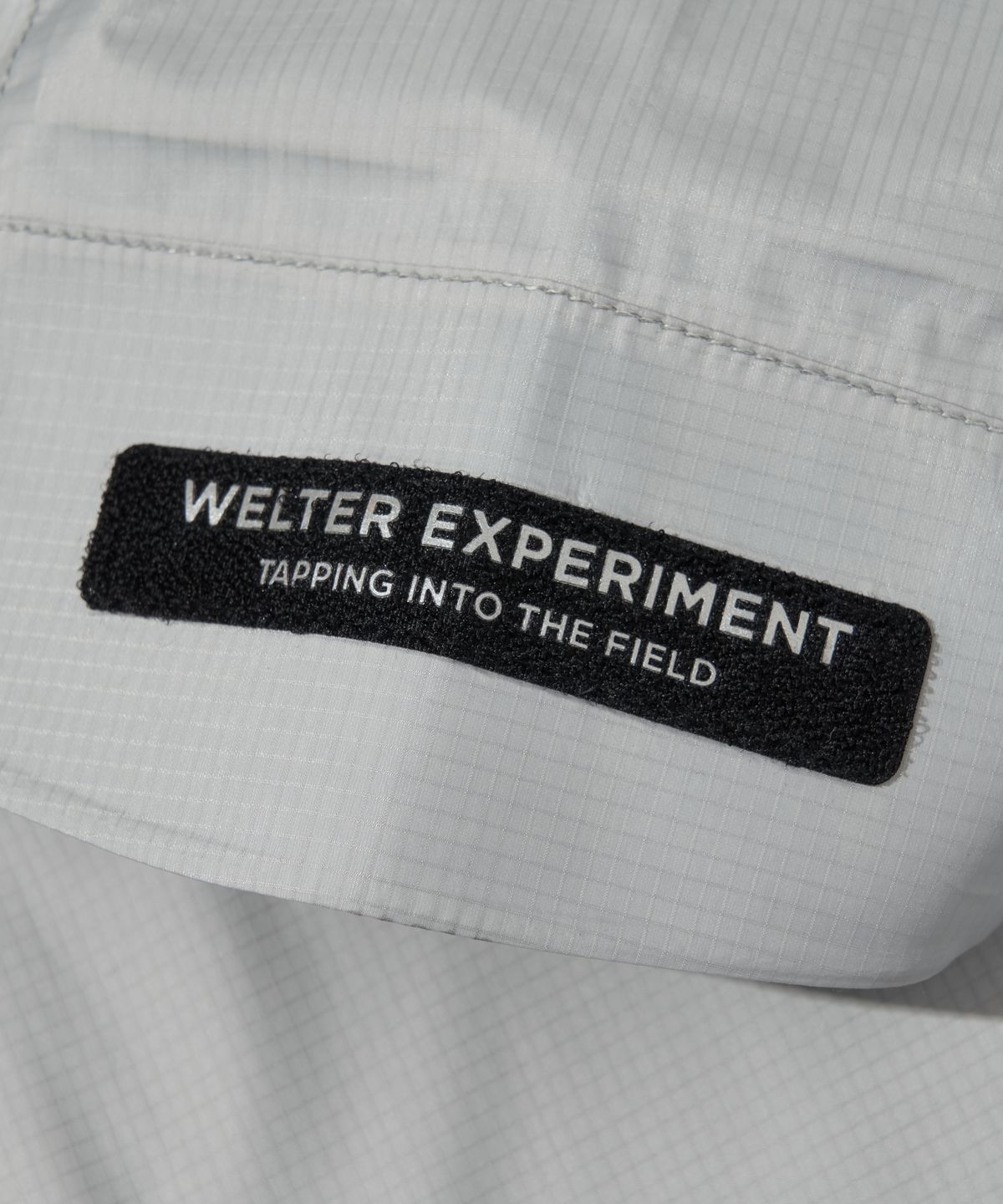 웰터 익스페리먼트(WELTER EXPERIMENT) 3LAYER REFLECTIVE STITCH JACKET_LIGHT GRAY_WOL056