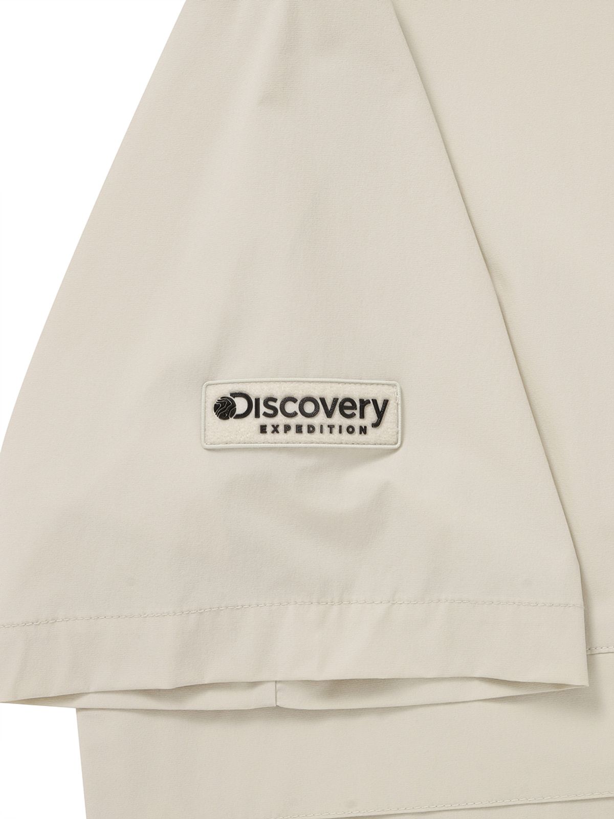 디스커버리 익스페디션(DISCOVERY EXPEDITION) 우븐 폴튼 반팔 후디드 아노락 (D.Skin Beige)