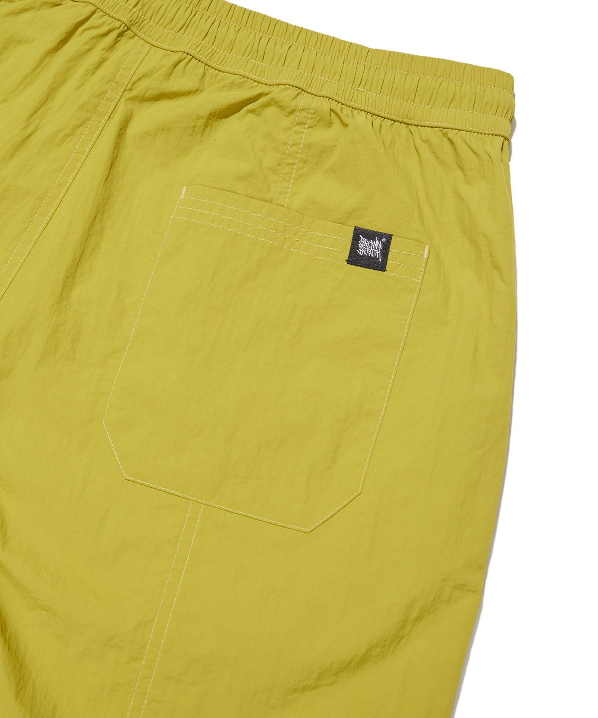브라운브레스(BROWNBREATH) TAG NYLON SHORTS - MURSTARD